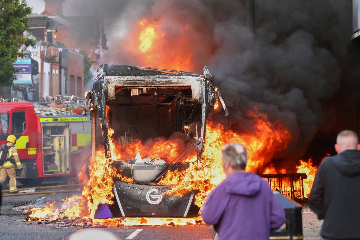 Thousands rally in Belfast to condemn anti-immigrant rioting that followed stabbing