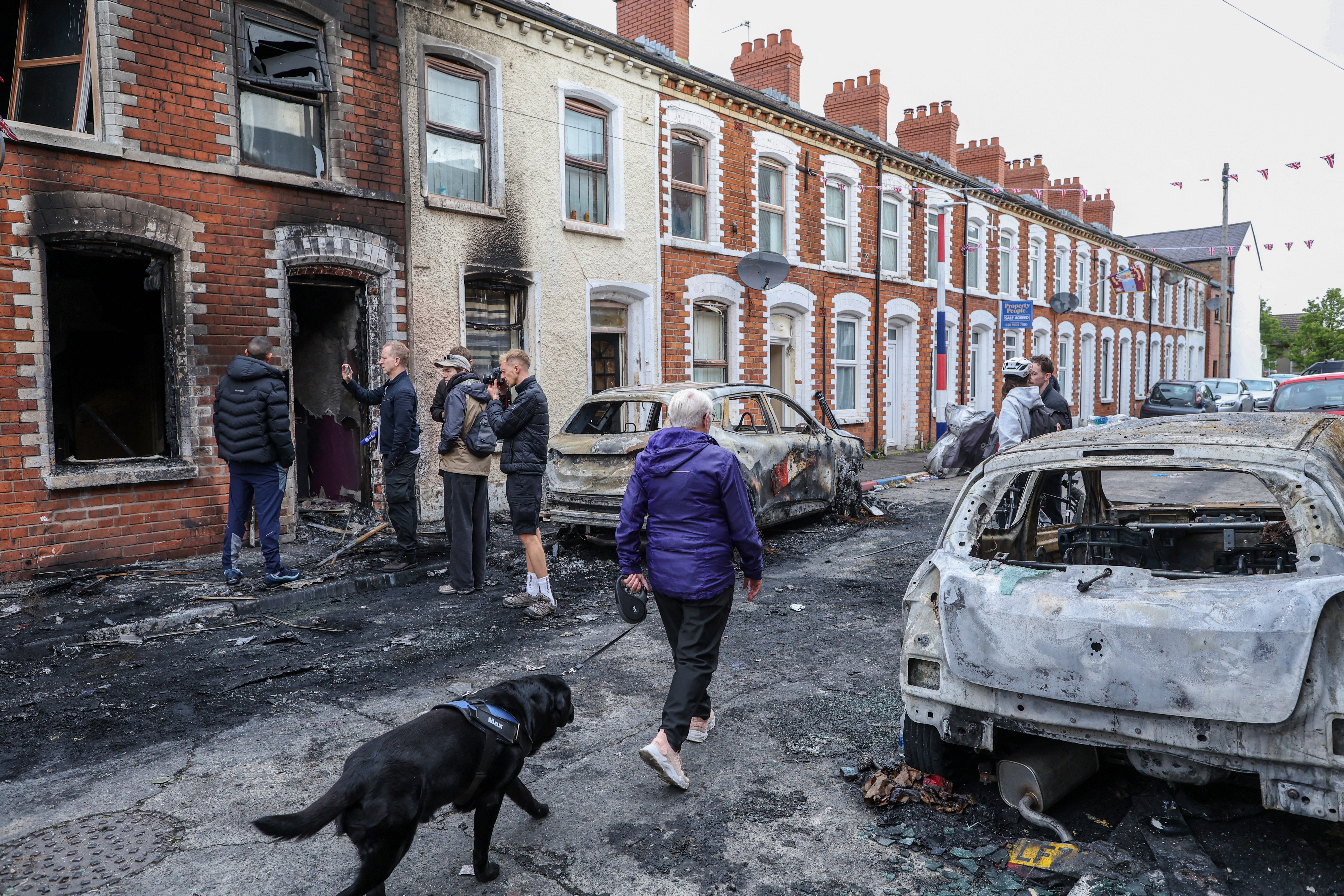 The aftermath of a riot which saw cars and homes targeted