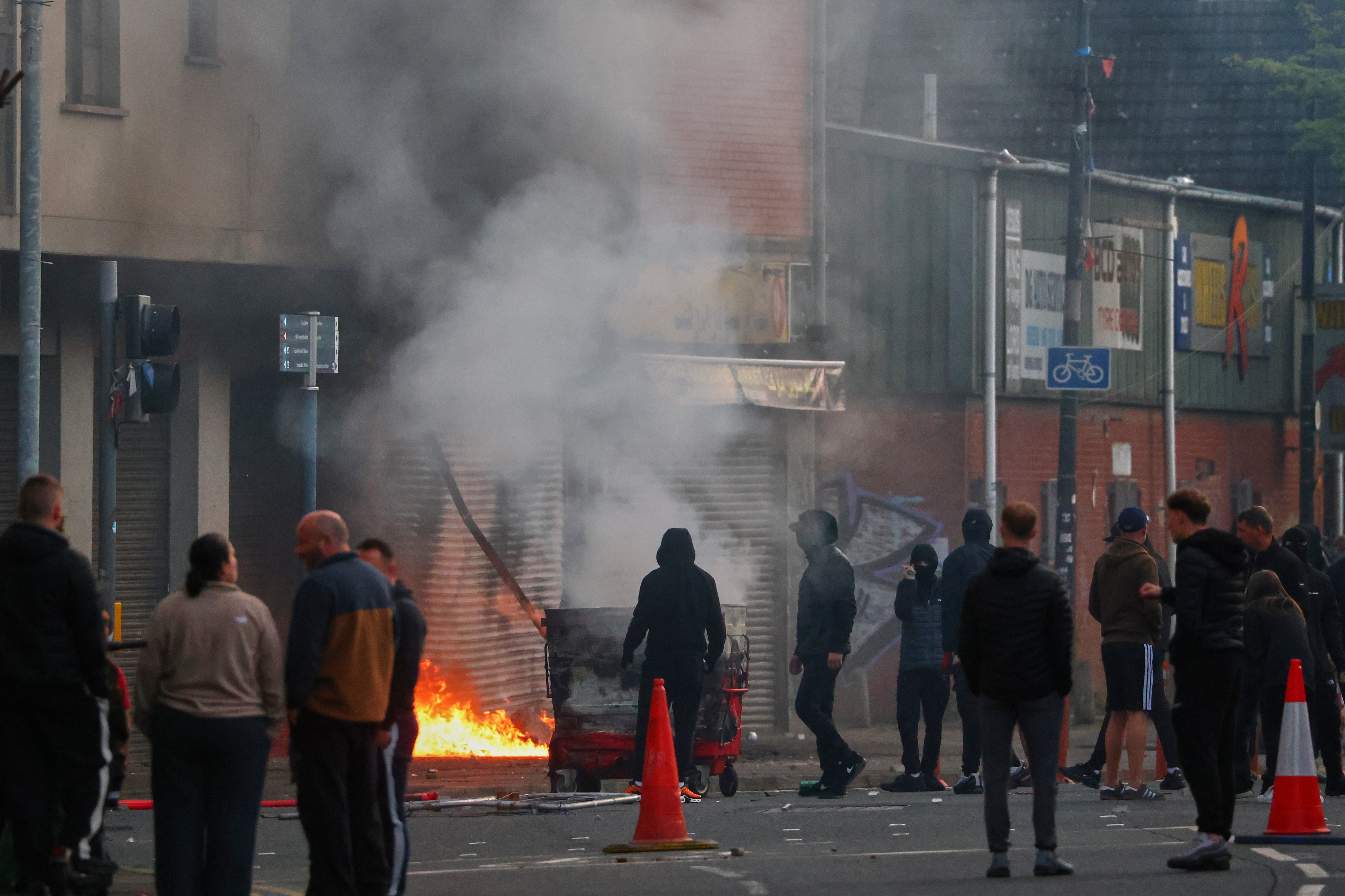 A building is set light to by protesters in central Belfast on Tuesday evening