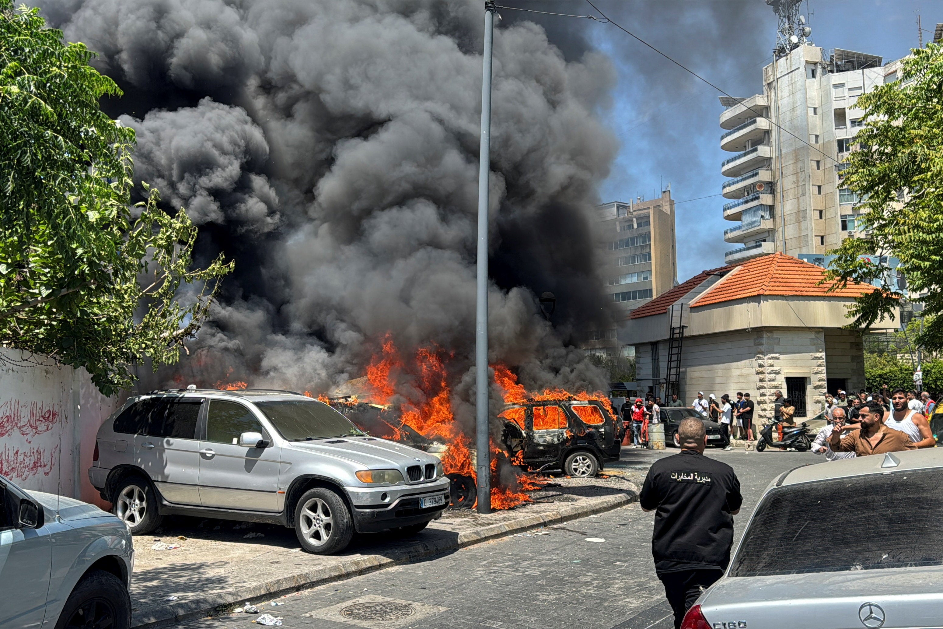 Smoke rises from vehicles burning following an Israeli strike in Sidon, southern Lebanon, on Wednesday (Reuters)