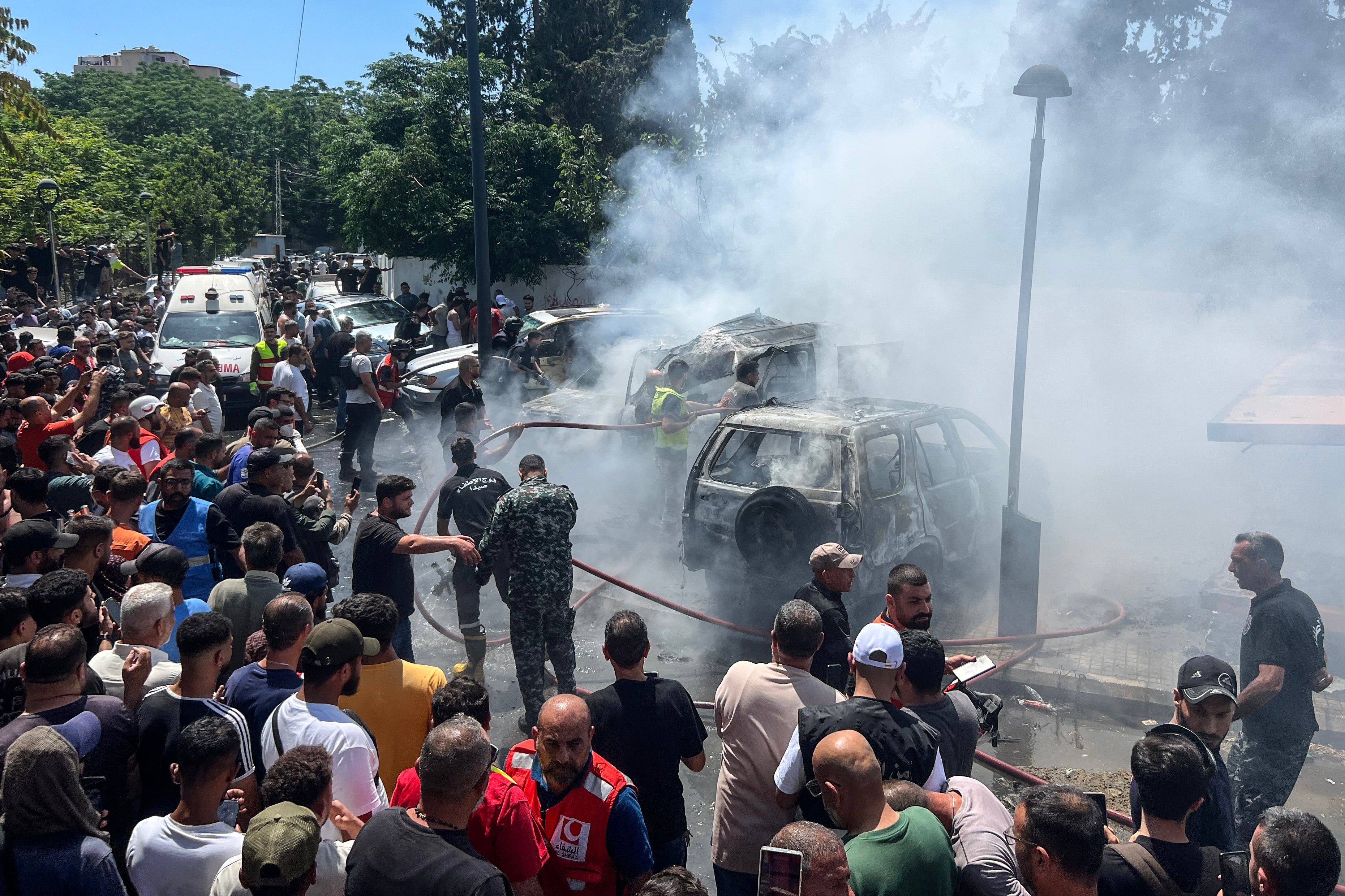 A car on fire after an Israeli airstrike on Sidon