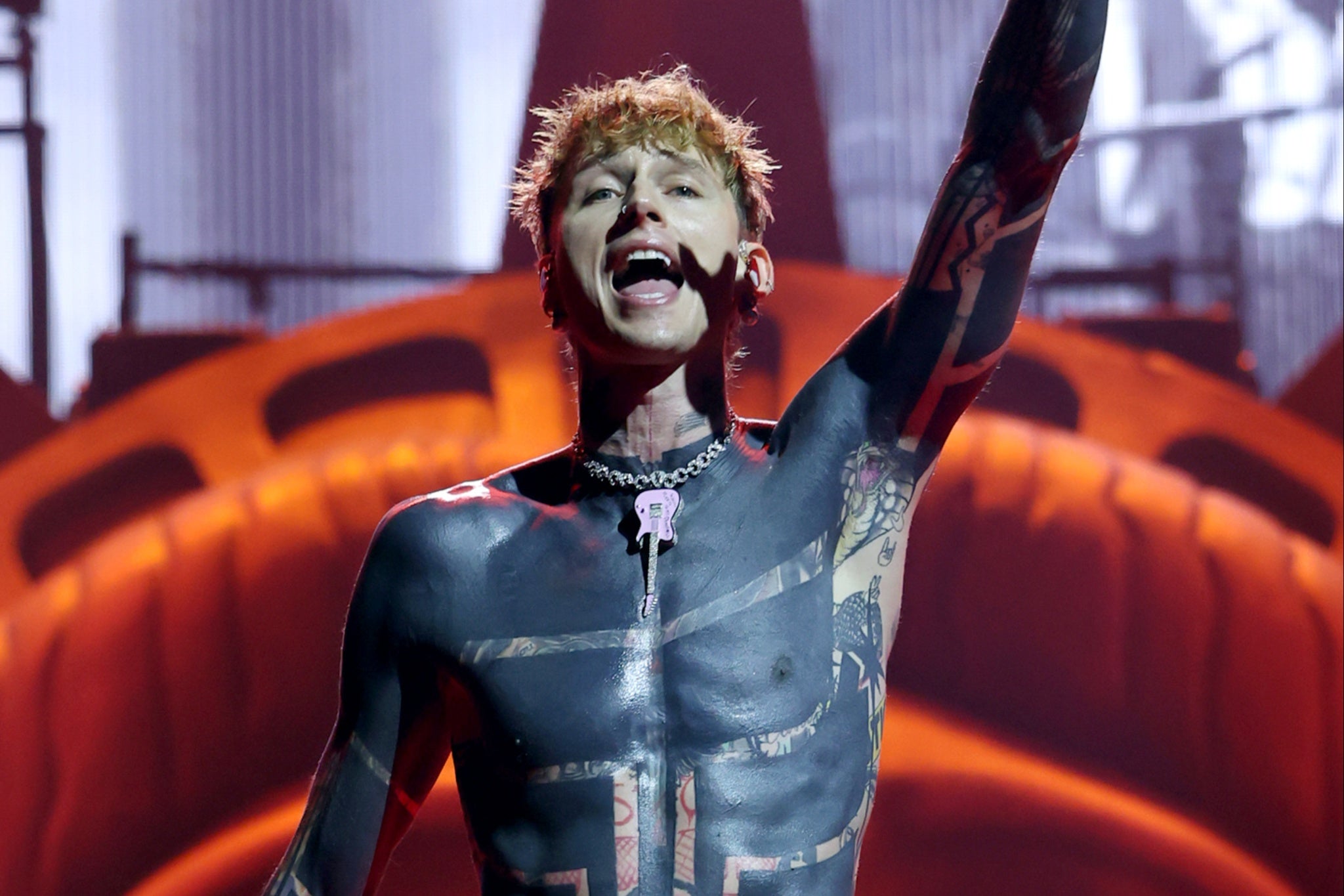 Machine Gun Kelly said he got his massive blackout tattoo done in two months