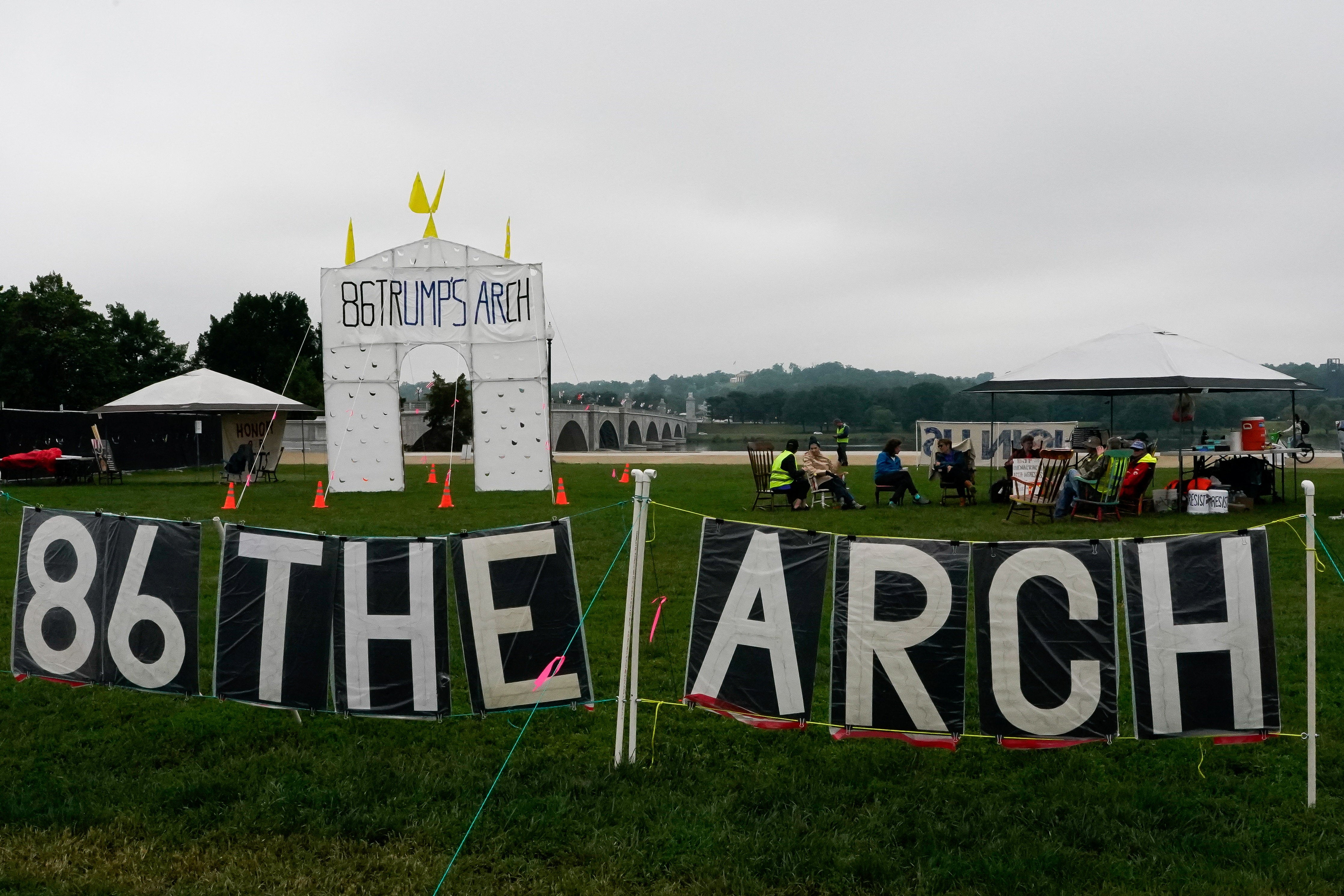 A protest near Arlington National Cemetery calling for the unpopular arch to be scrapped (Reuters)