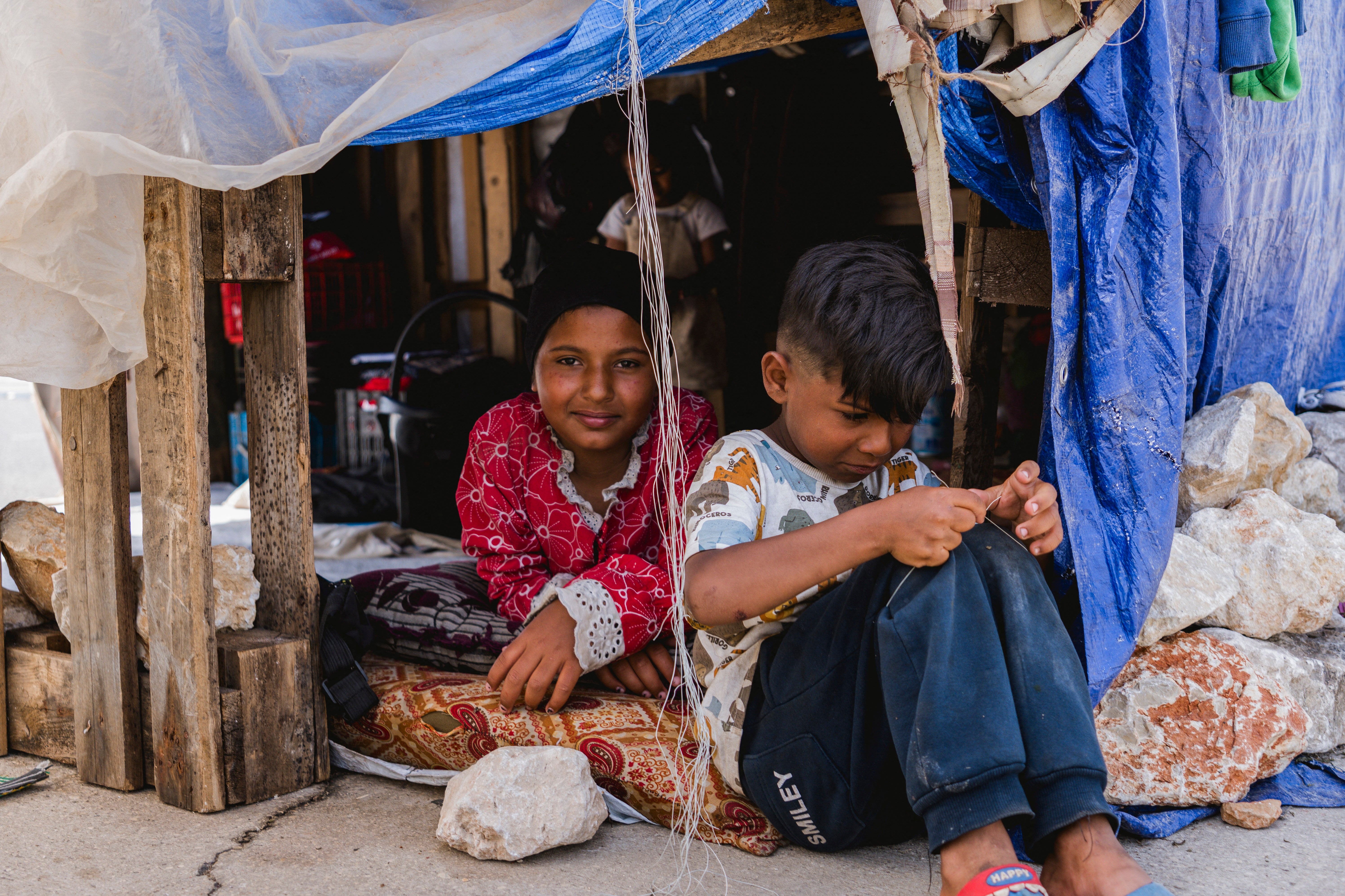 Two children sit in a shelter on the Beirut waterfront on 12 May.