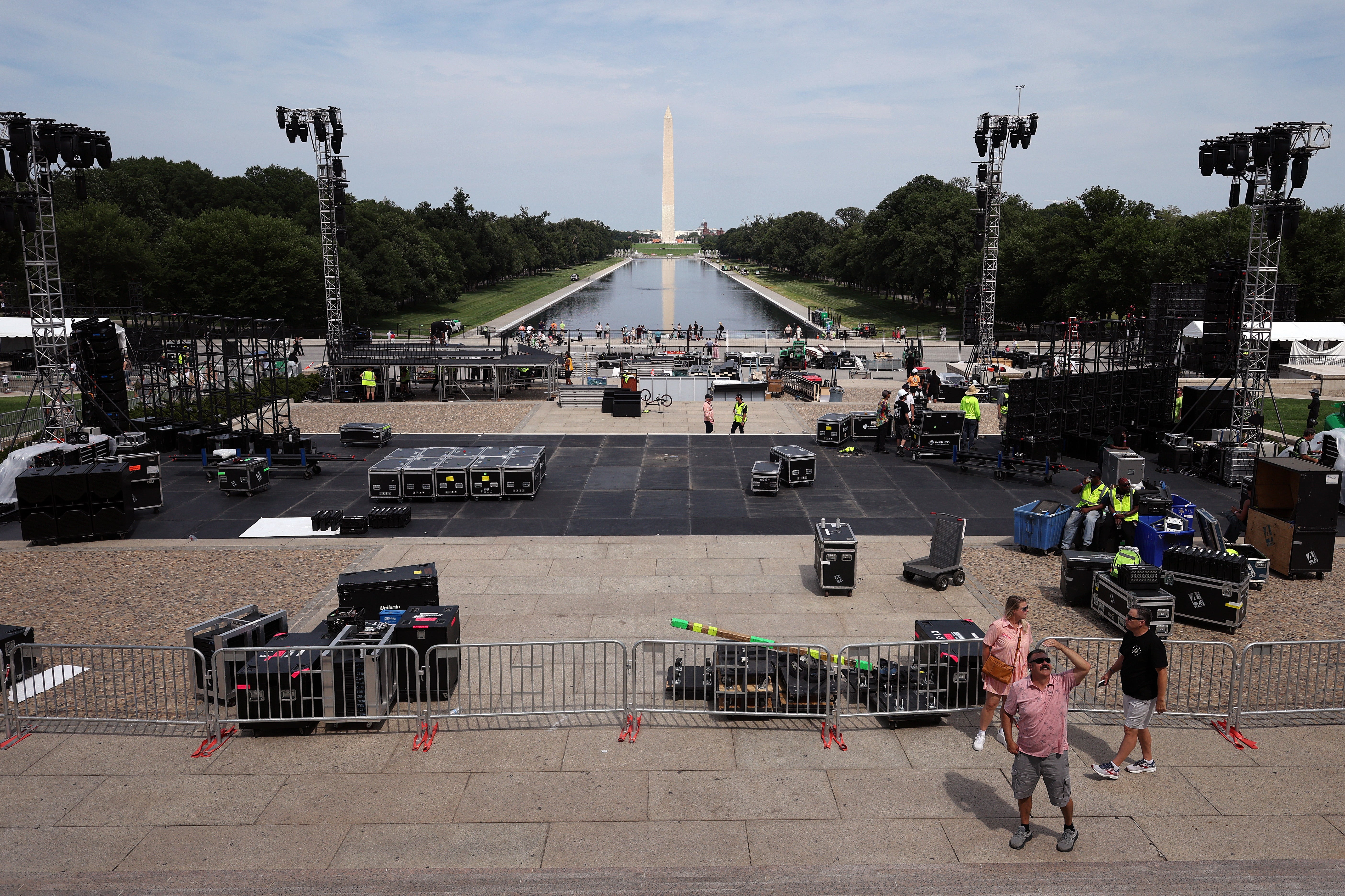 View from the stairs of the Lincoln Memorial shows crews setting up stage lights, temporary fencing and other equipment in advance of the UFC Freedom 250 press conference (Getty)
