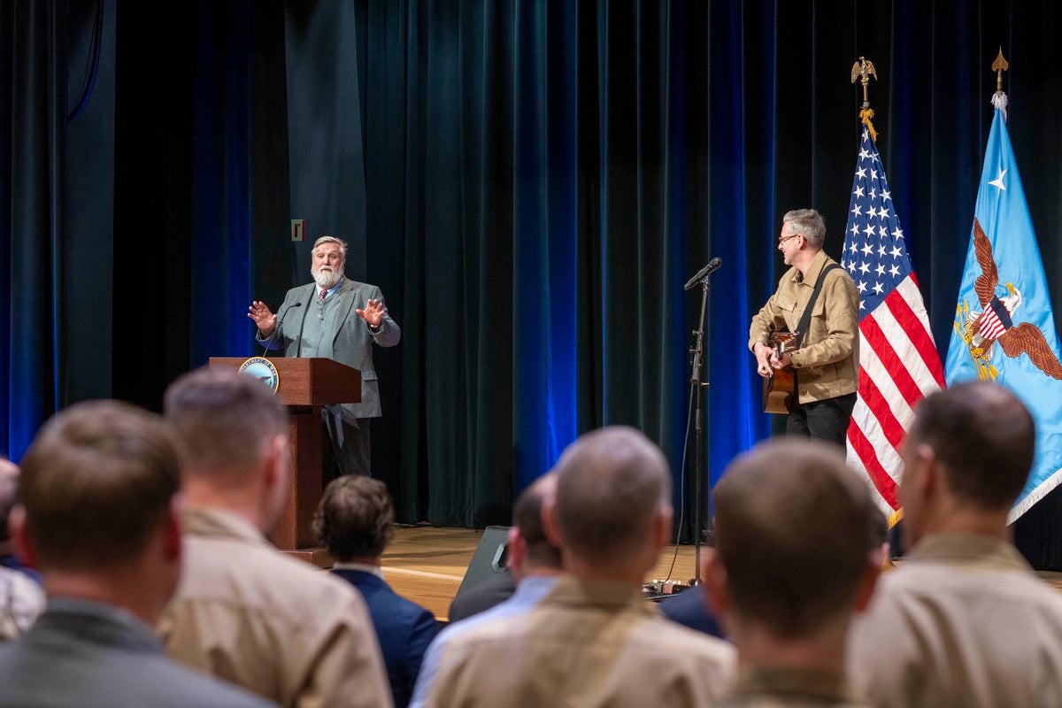 Doug Wilson, left, preaches during a Pentagon prayer service hosted by Hegseth on Feb. 17, 2026, in Washington