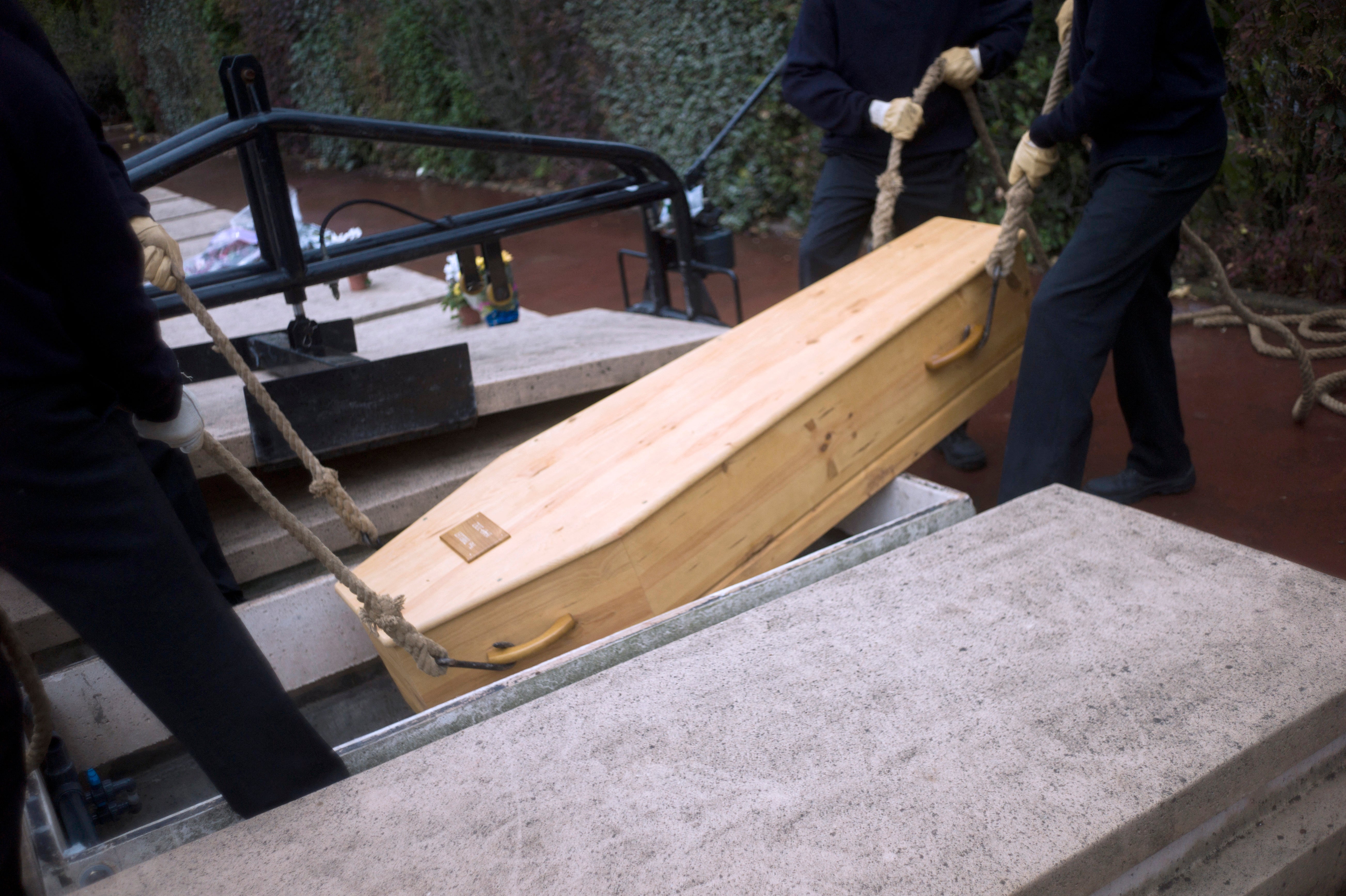 Grieving widow sues after late husband&rsquo;s body falls from casket during burial
