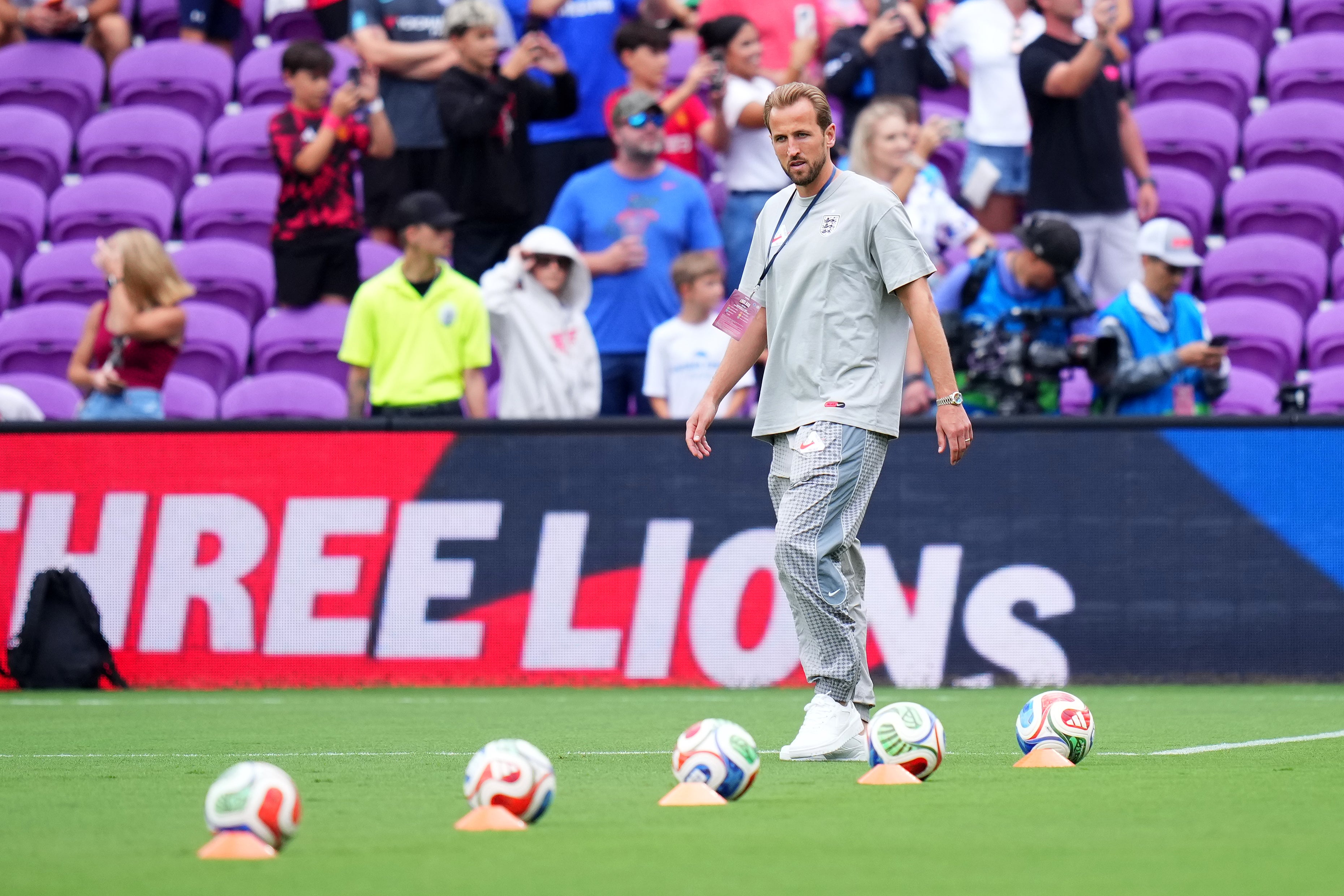 Harry Kane checks out the pitch. (Getty Images)