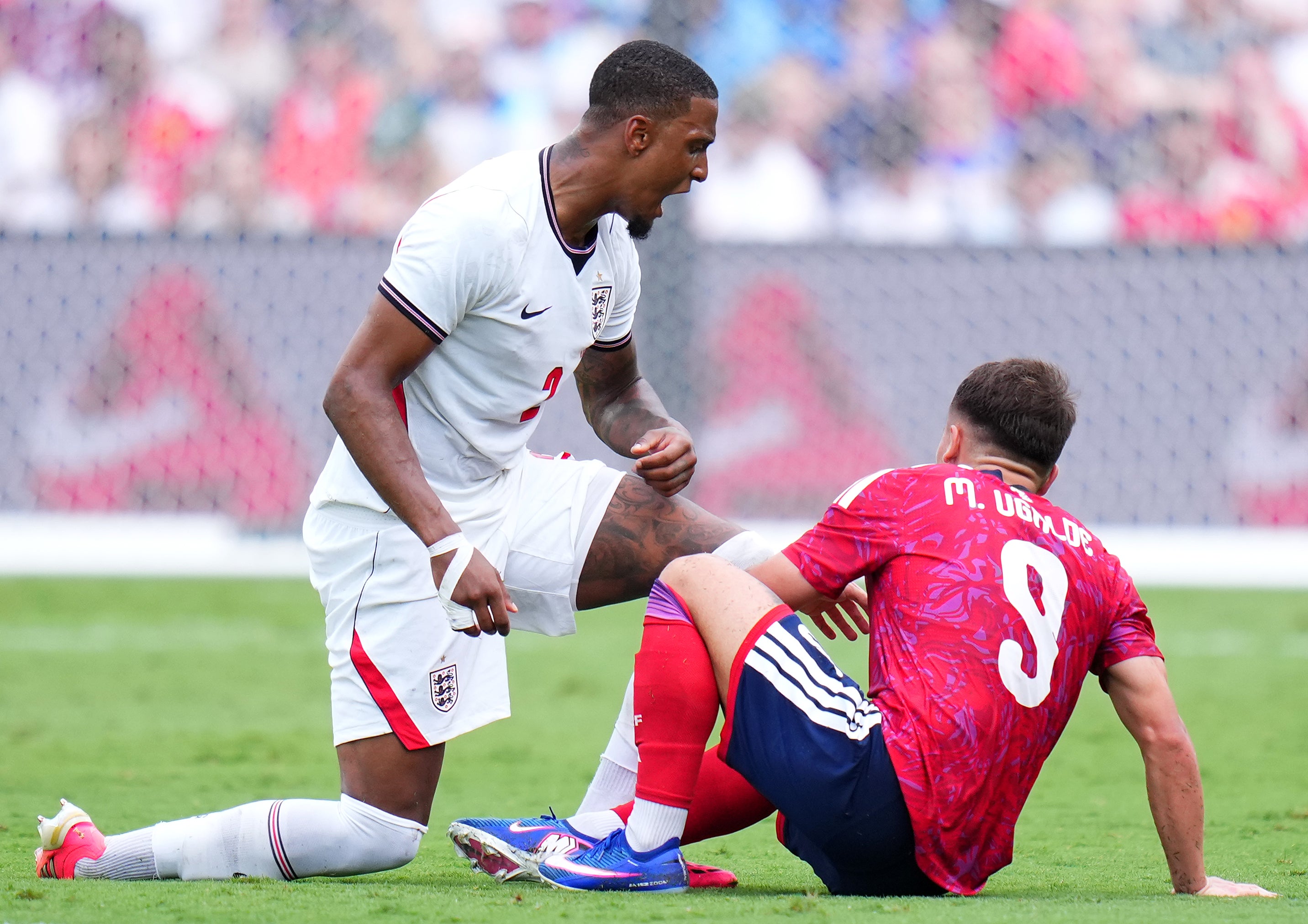 Konsa goes down under pressure from Ugalde. (Getty Images)