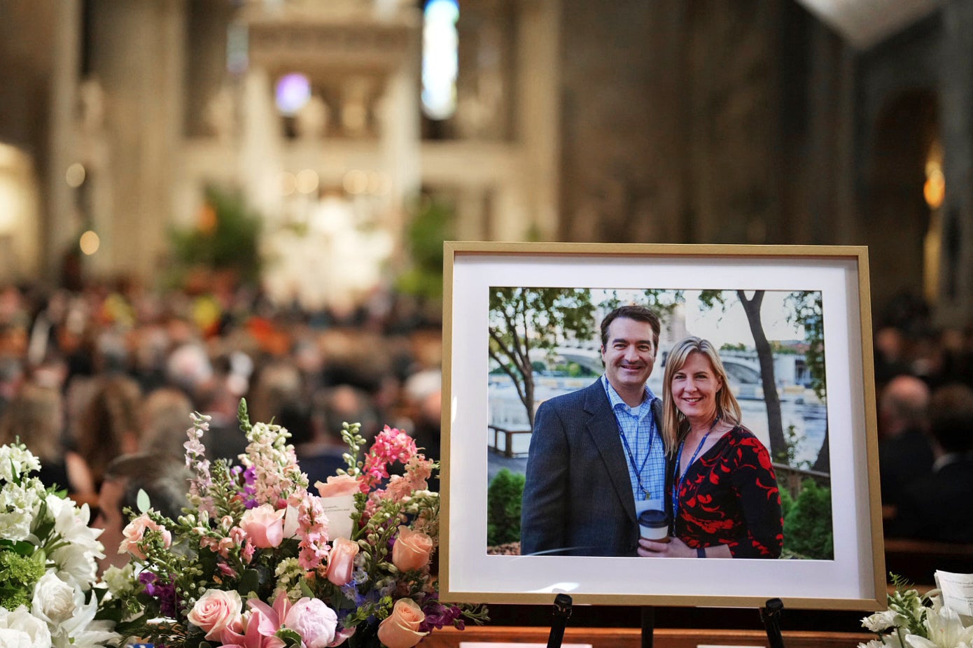 A photo of Mark and Melissa Hortman is displayed during their funeral service inside the sanctuary at the Basilica of St. Mary's in Minneapolis