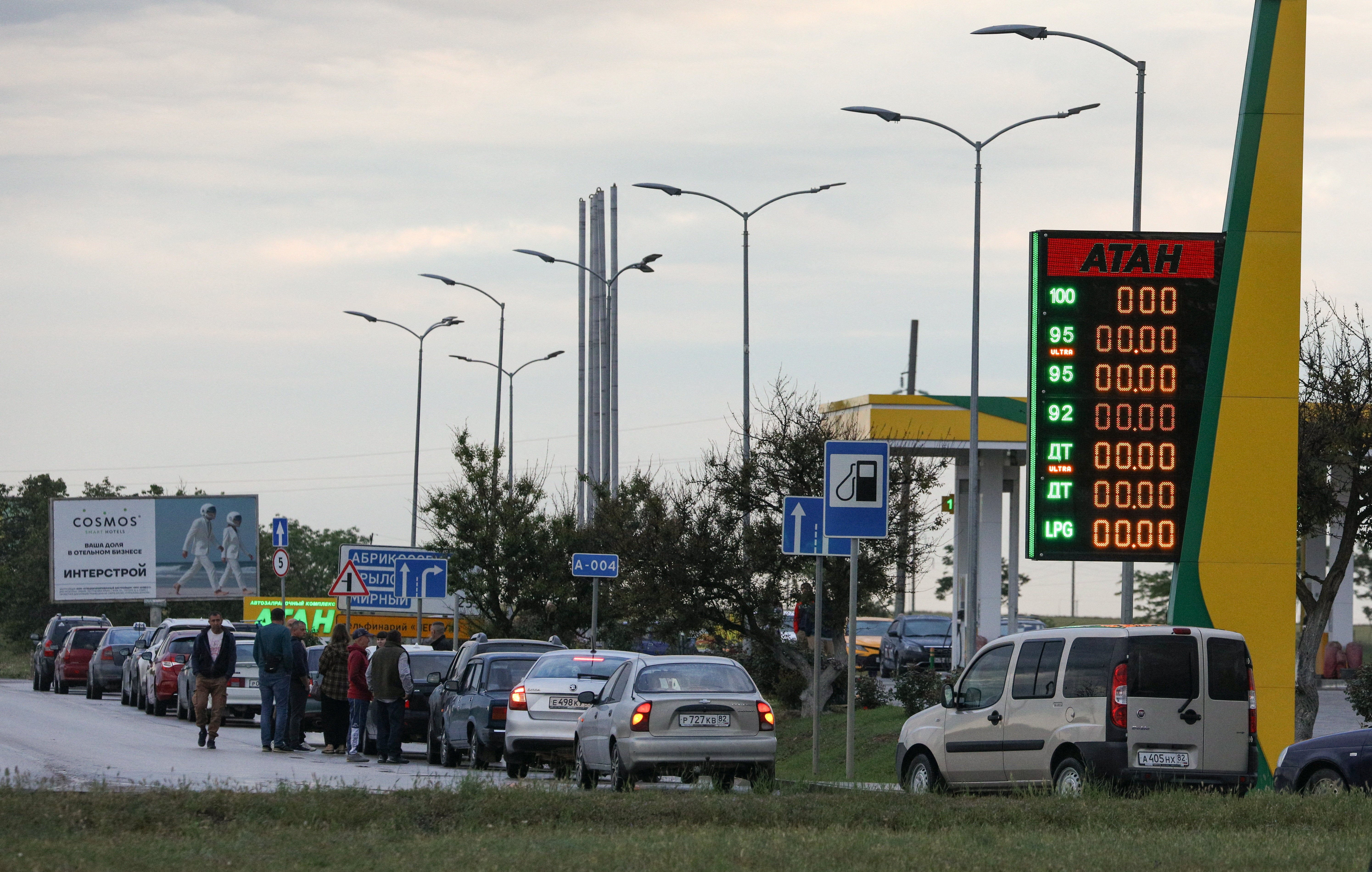 Cars queue for fuel at a gas station after the authorities restricted fuel sales amid a supply shortage following Ukrainian attacks on logistics routes in the course of Russia-Ukraine conflict, in the Black Sea resort city of Yevpatoriya, Crimea
