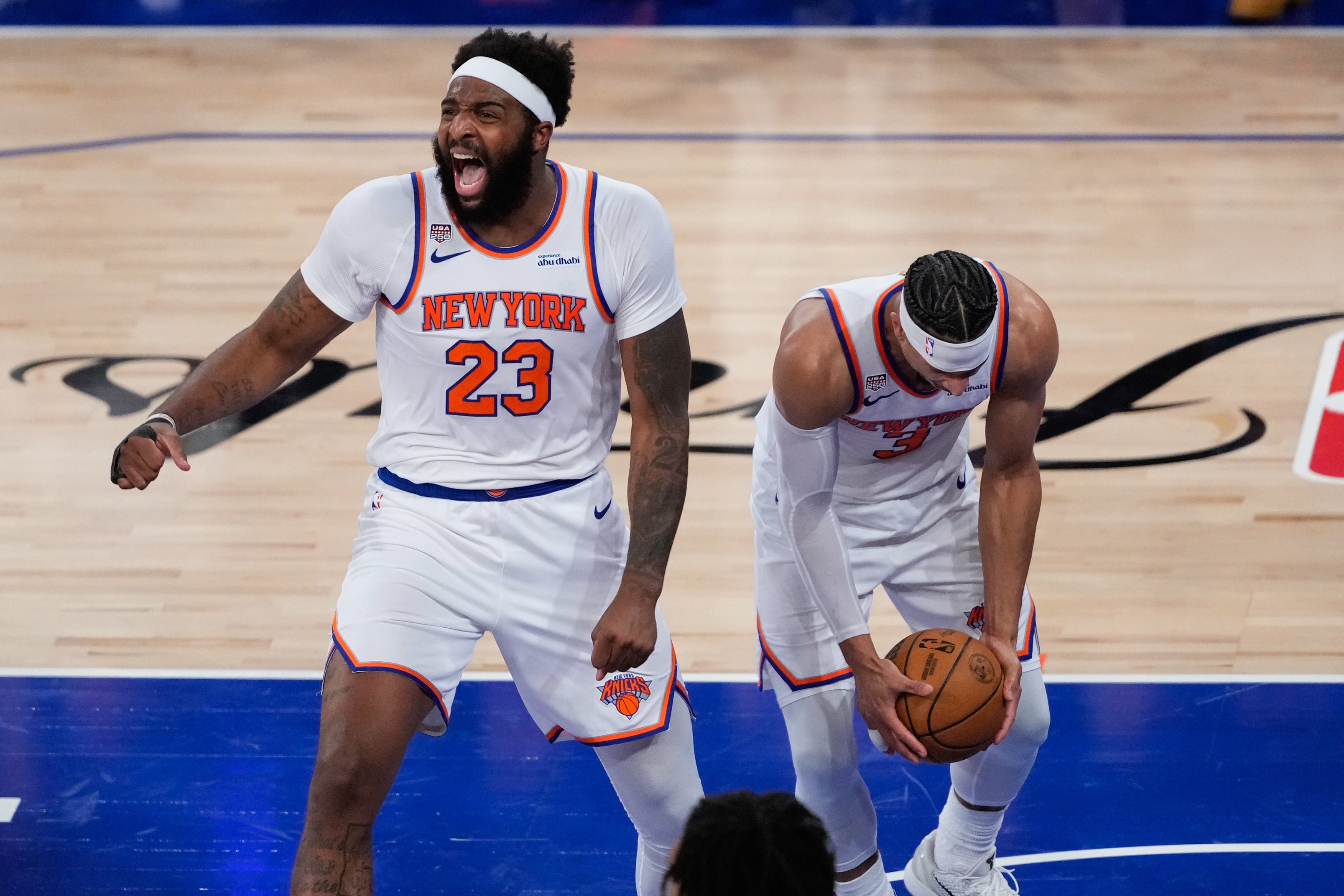 Mitchell Robinson (23) and Josh Hart (3) celebrate for the Knicks