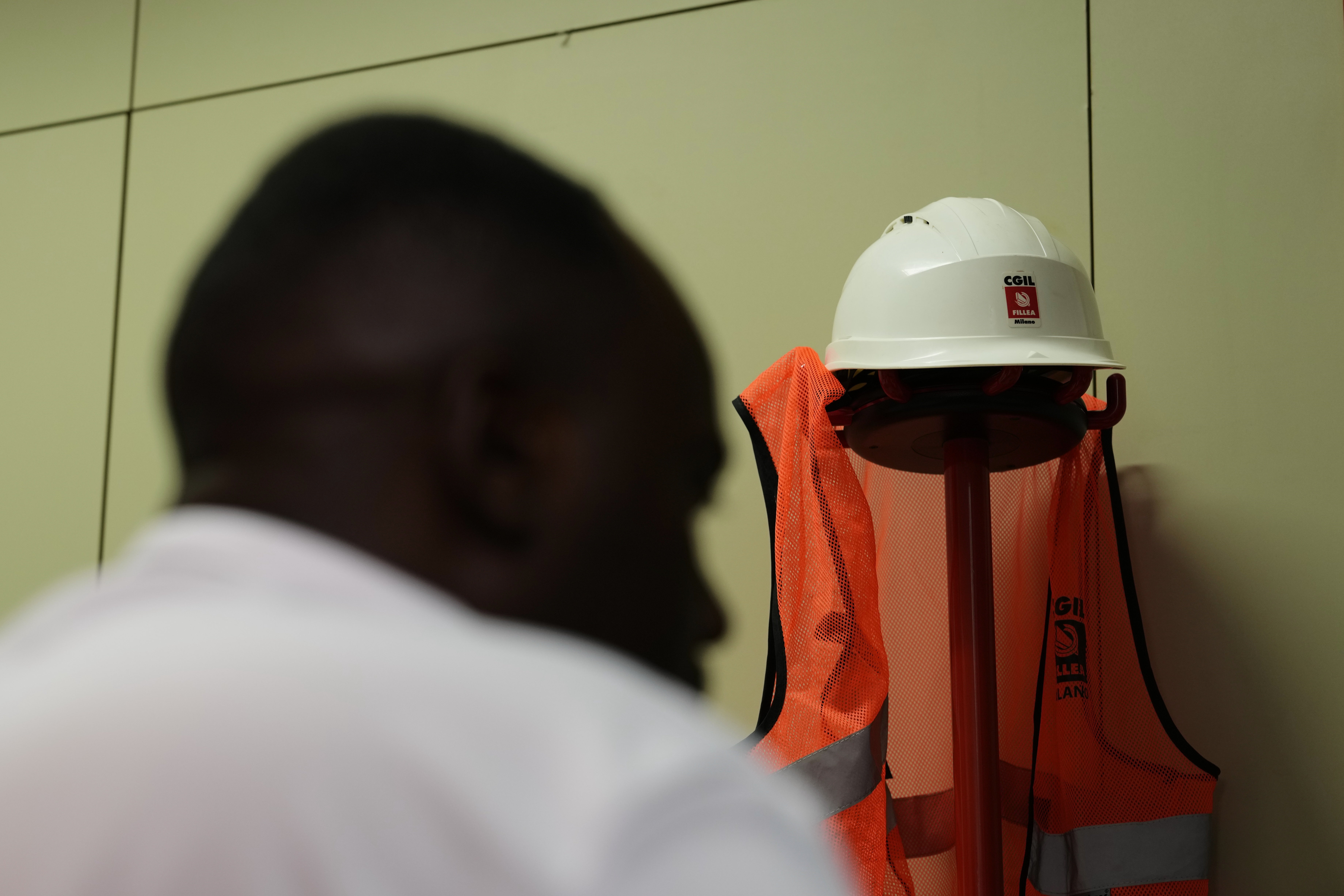 A former Caddell worker, who asked that his name not be published, speaks with The Associated Press during an interview in Milan