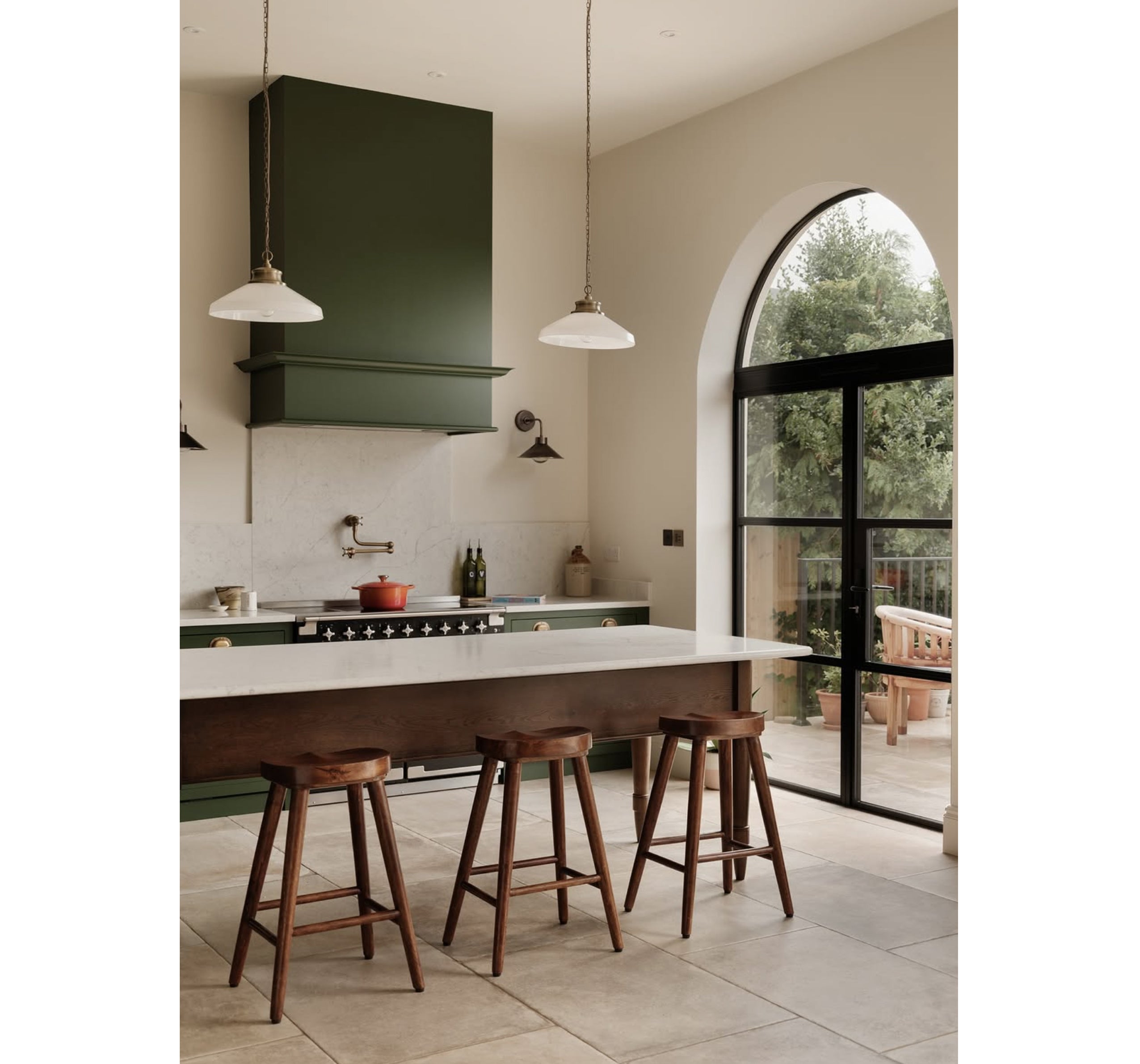 A flexible kitchen layout pairs a generous island with calm, concealed storage, showing how zoning can help a busy kitchen feel both practical and beautifully organised (Studio BN/PA)