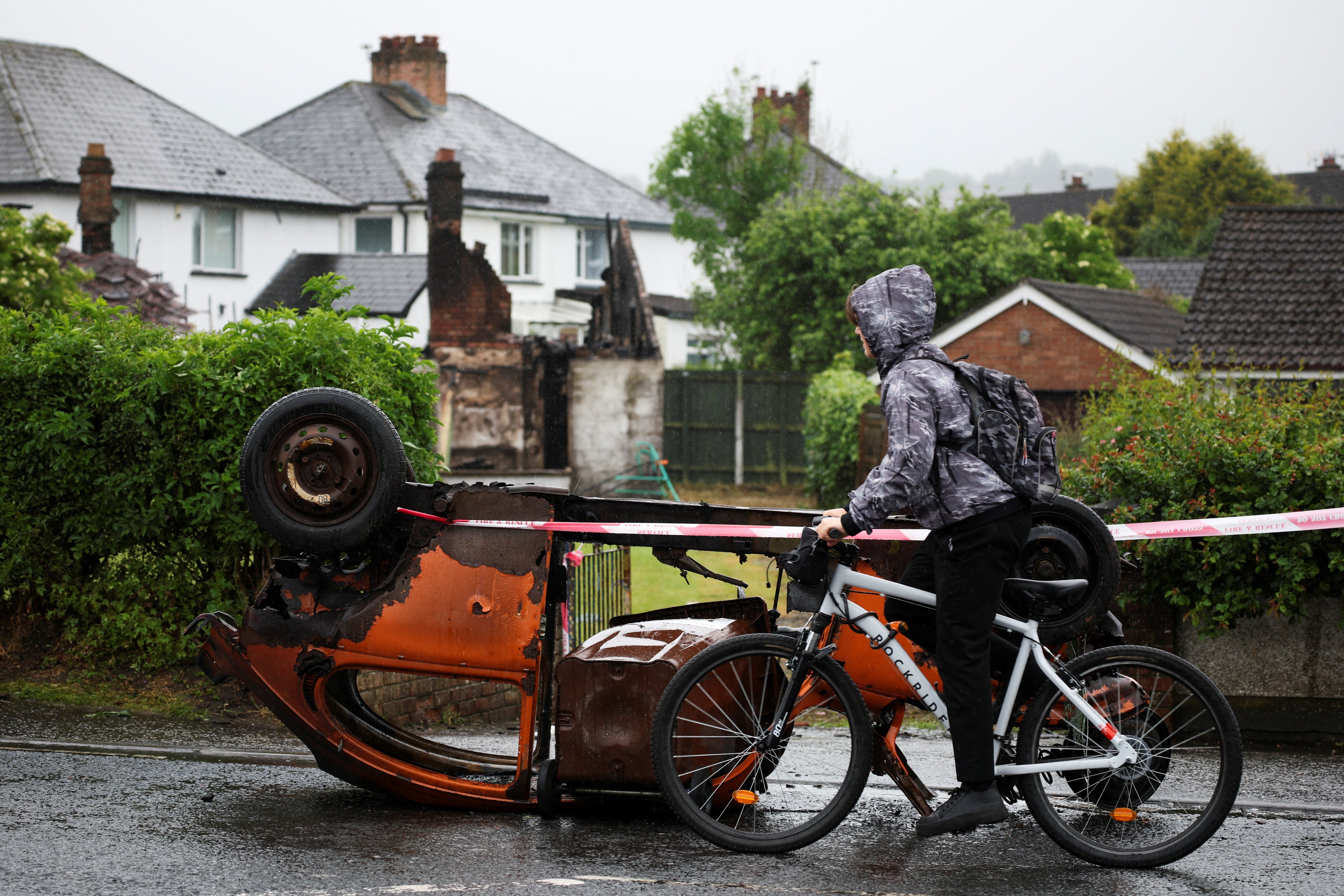 The clean-up operation continues in parts of Belfast where protests turned ugly this week (Reuters)