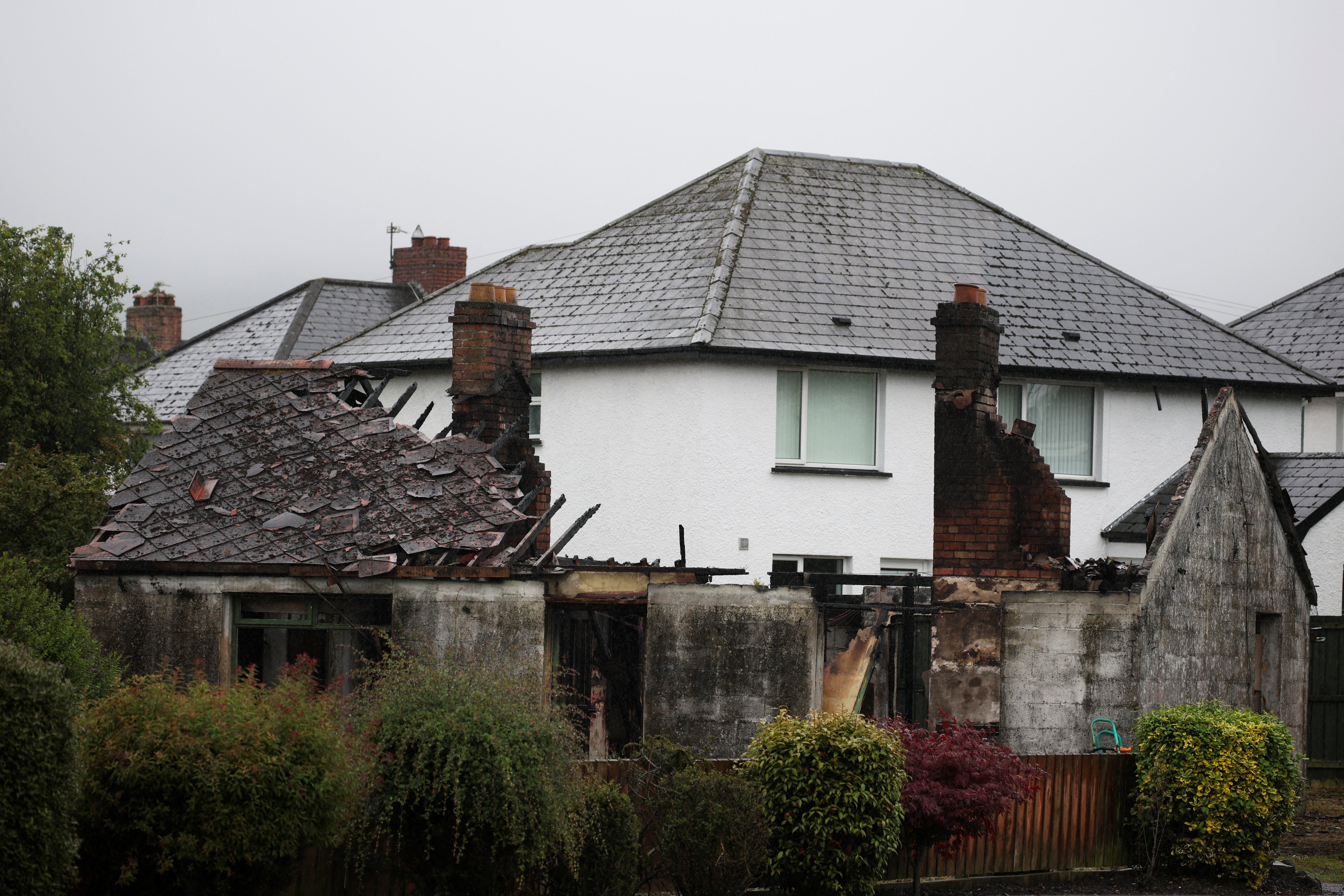 Signs of the violent disorder that saw homes torched scar the community (Reuters)