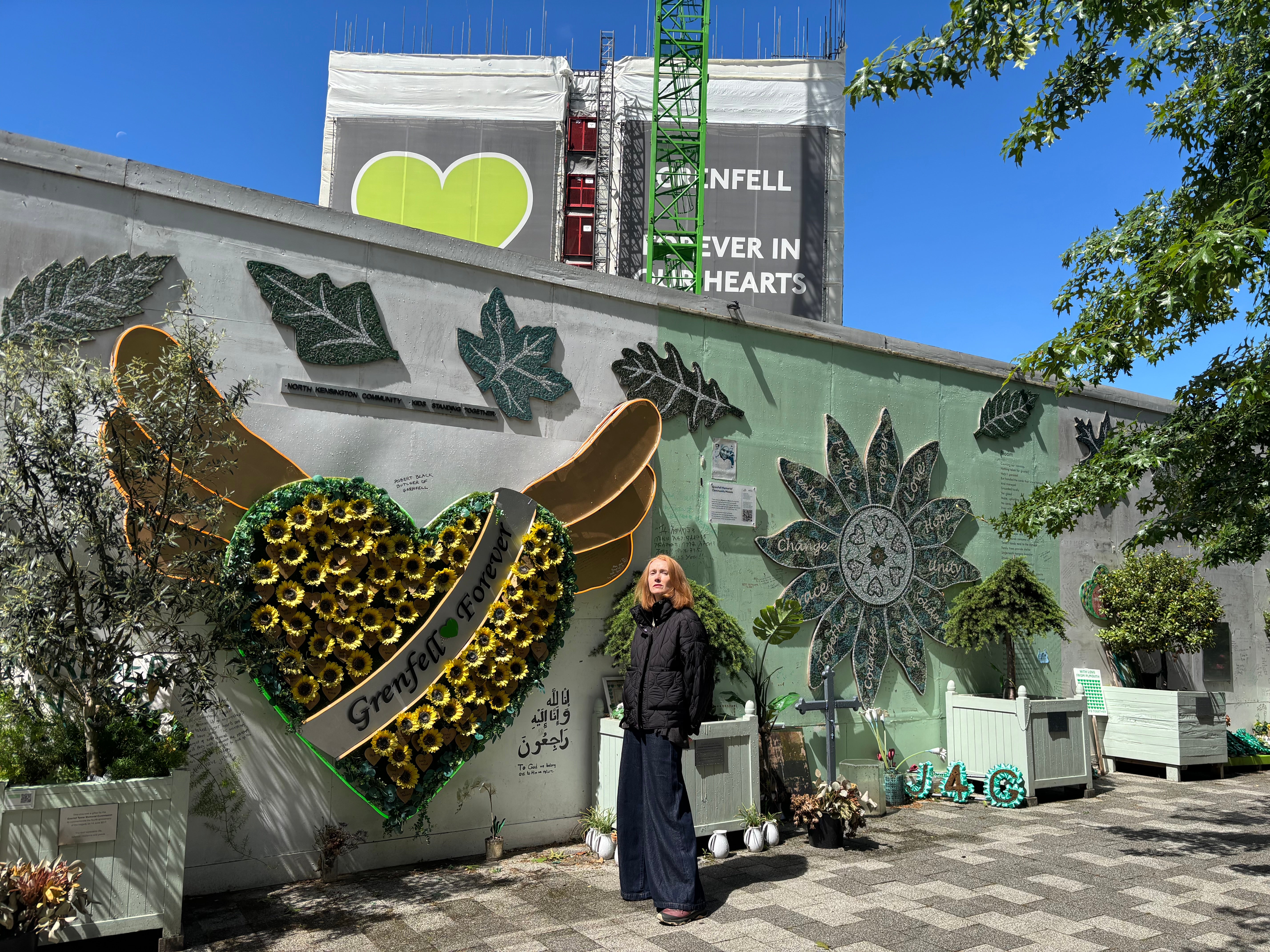 Melanie Juno Wolf at the Grenfell Tower memorial wall