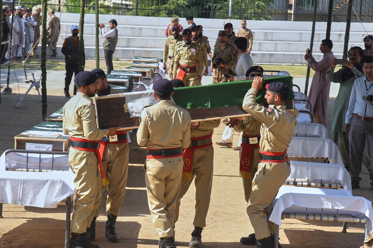 A mass funeral is held for 22 Pakistani soldiers who died in