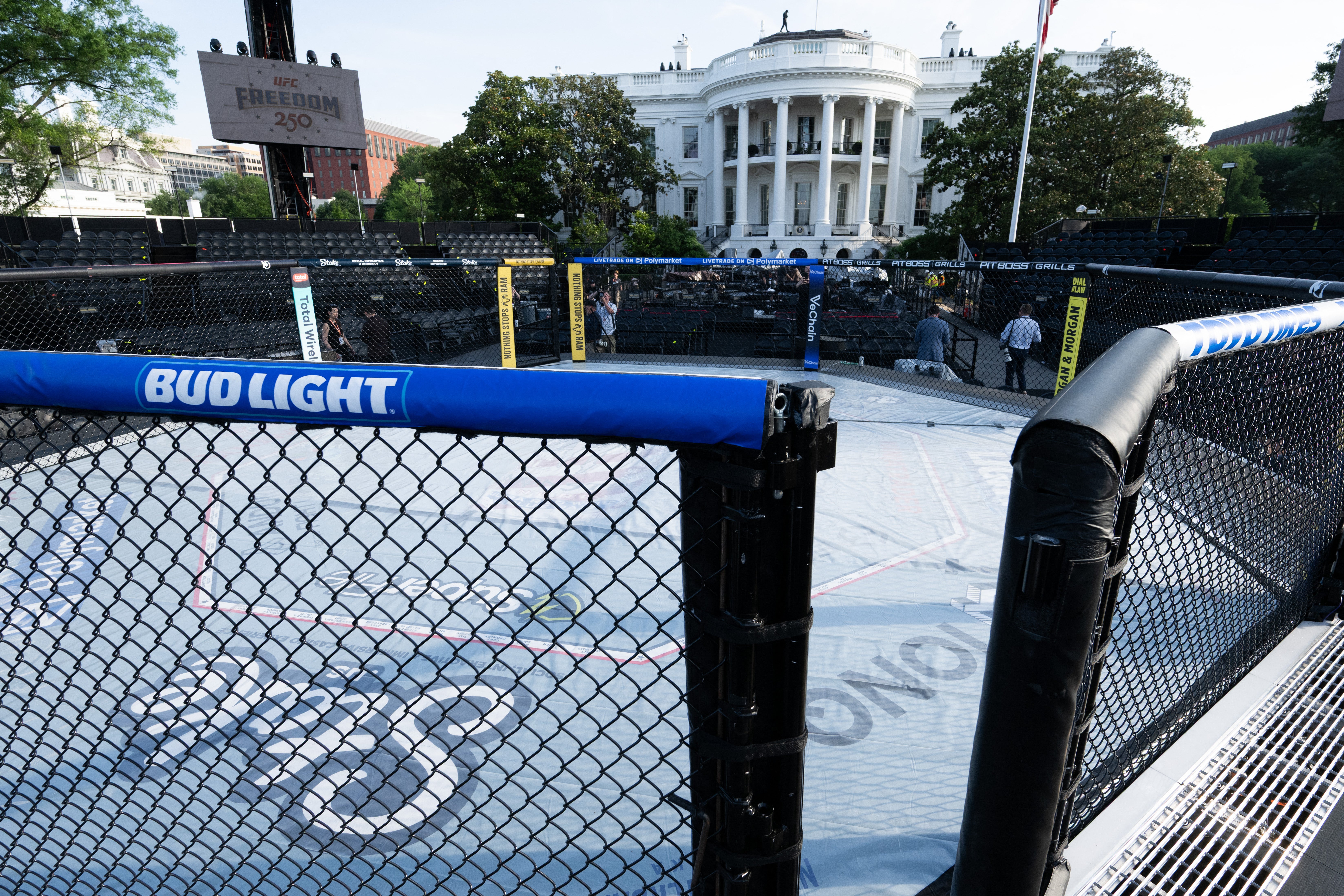 The octagon features branding from companies that partner with UFC, such as Bud Light and Polymarket, in addition to the event’s sponsors, Crypto.com and Ram Trucks