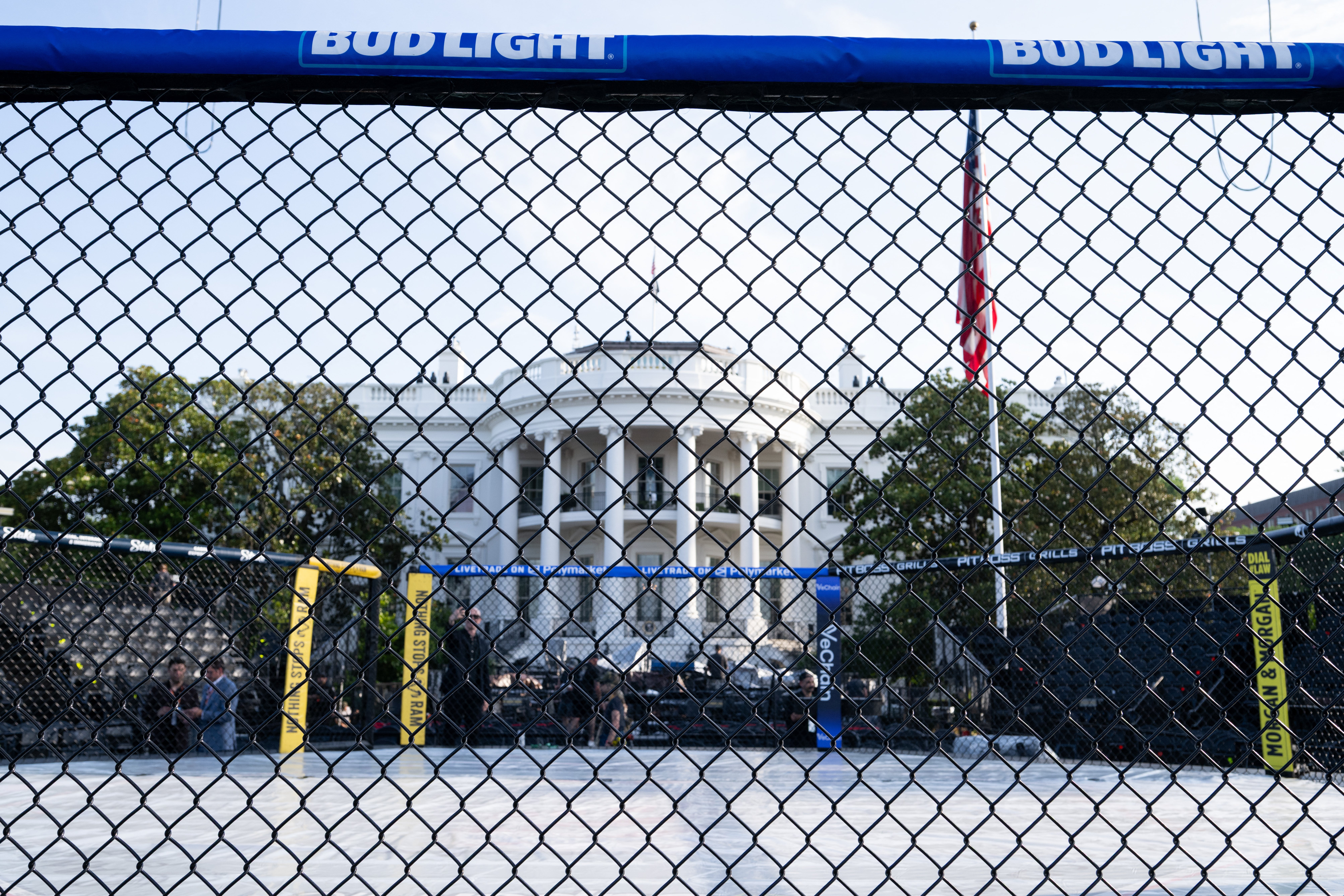 The White House is seen through the octagon’s enclosure, which carries advertisements for Bud Light beer