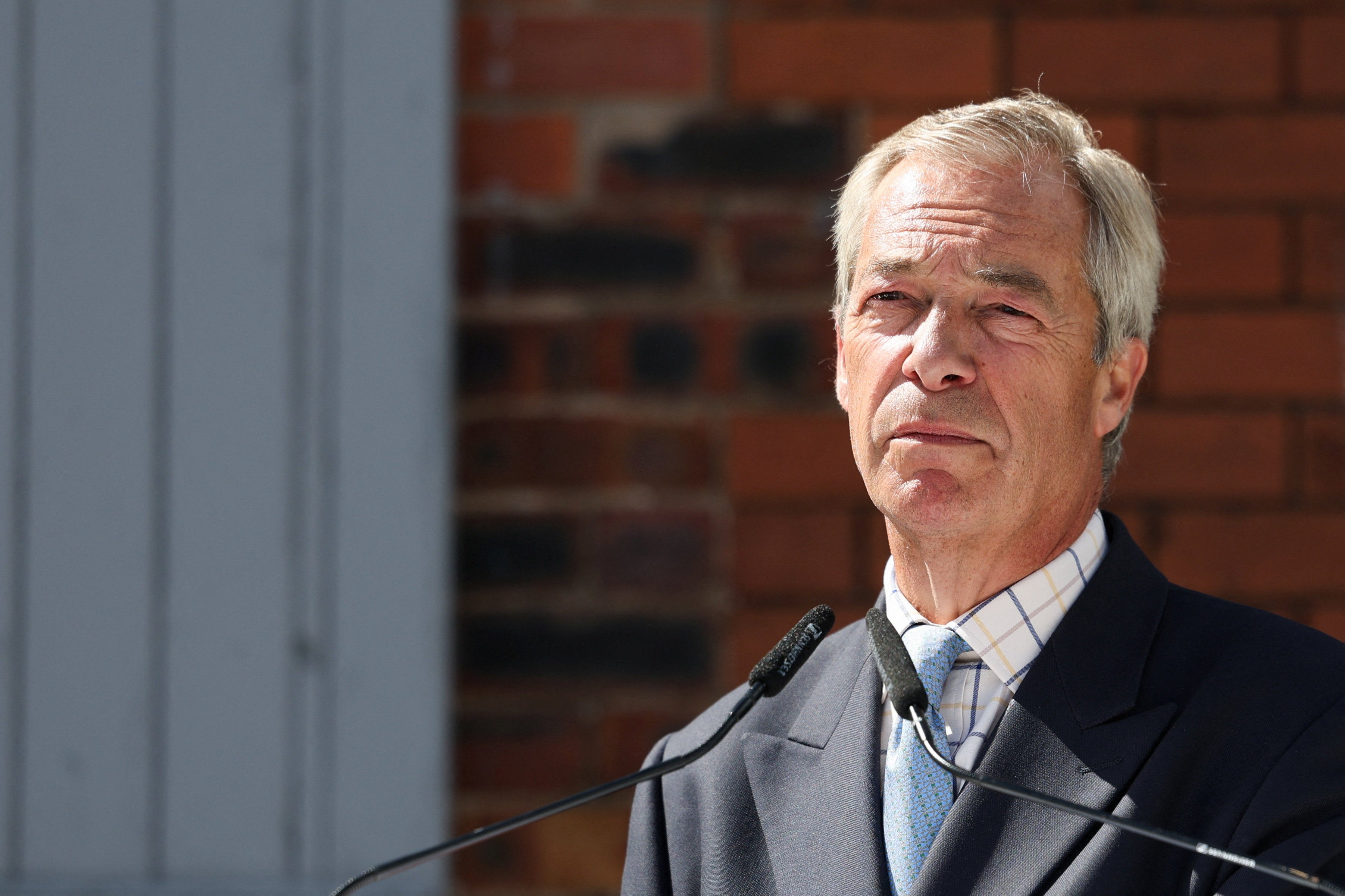 Nigel Farage after reinstating Reform UK councilor sacked over racist social media posts 