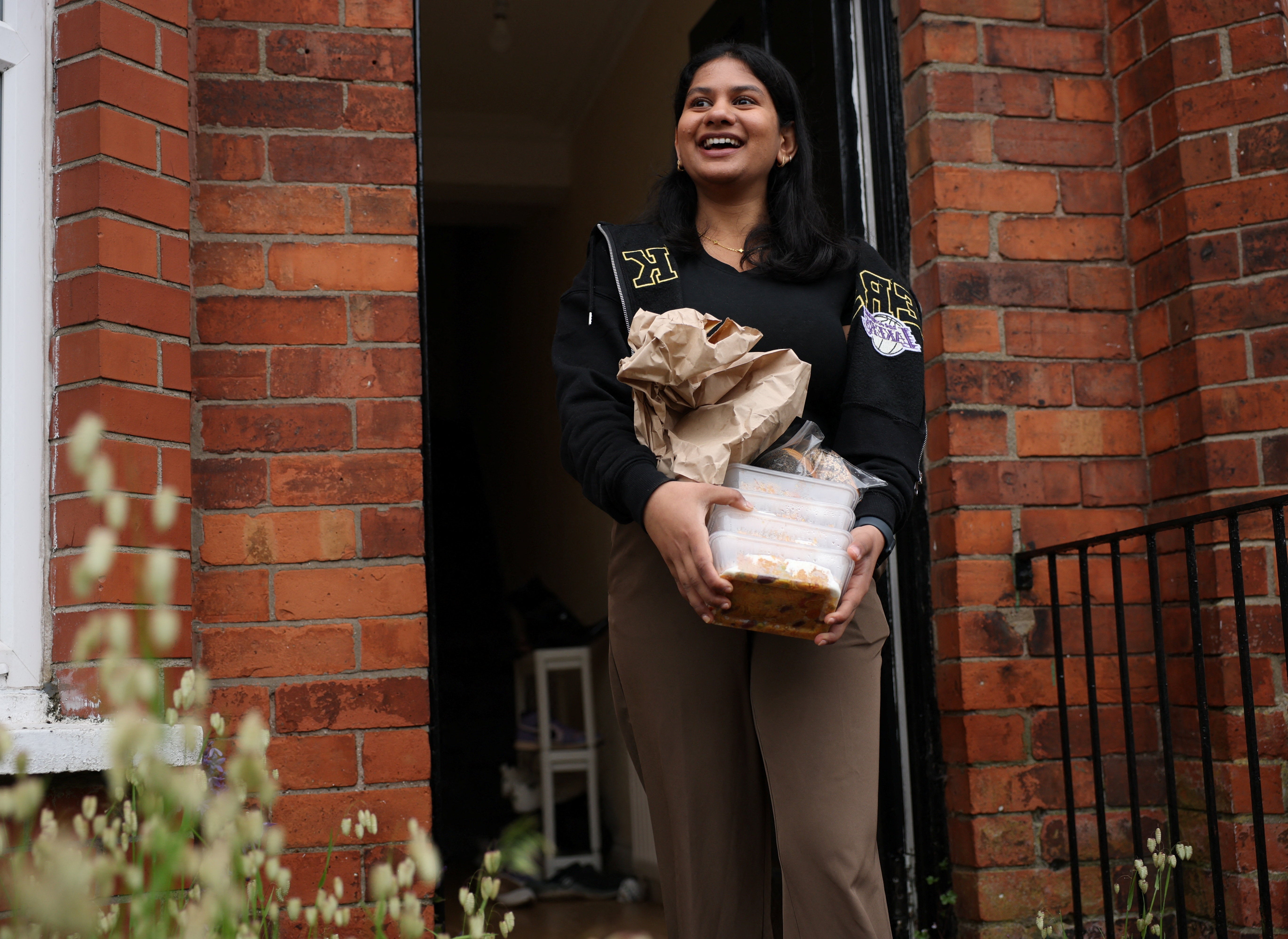 Ruchira Rangaprasad delivers food to vulnerable migrants, following a knife attack that sparked a wave of protests (Reuters)