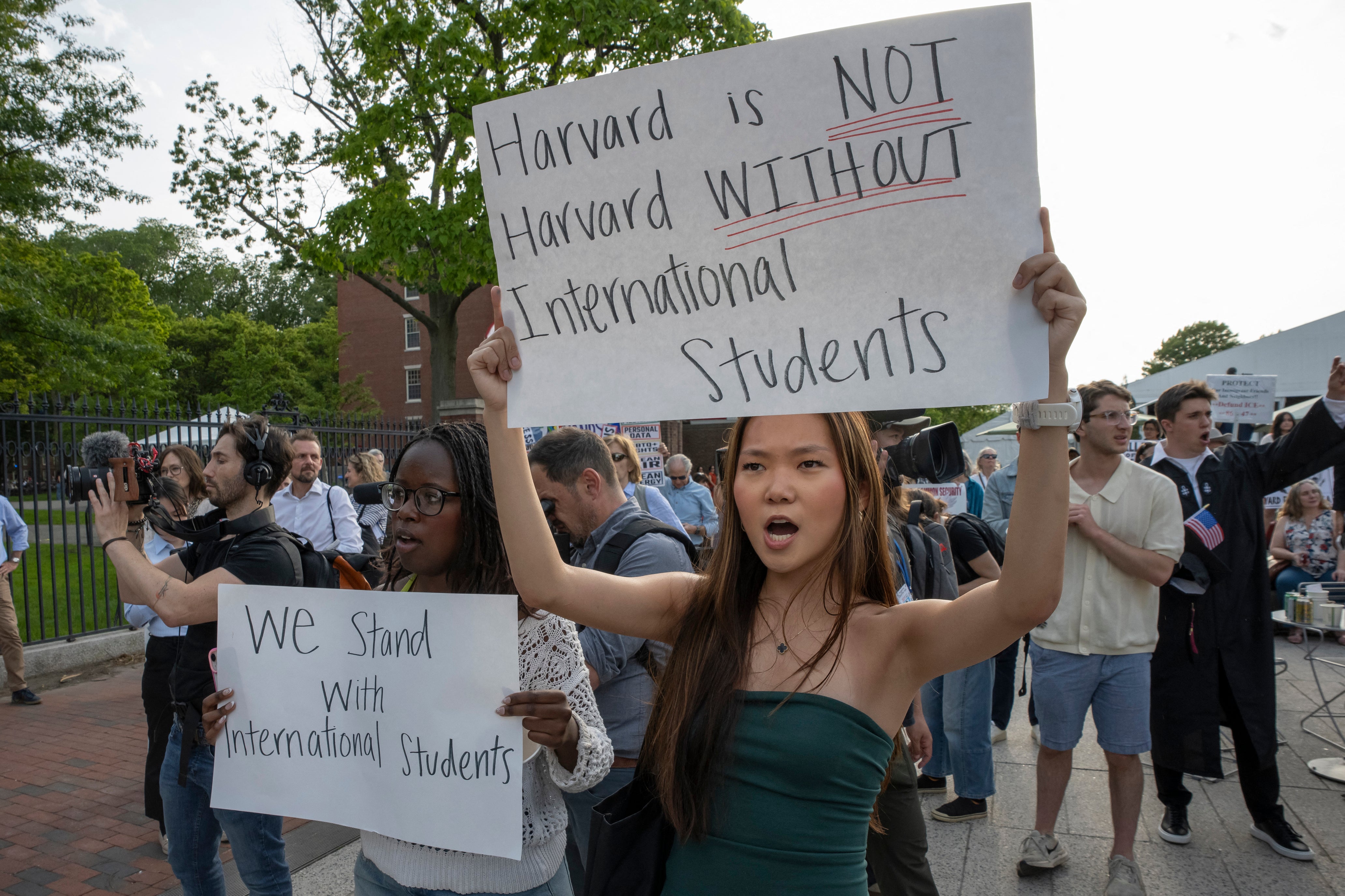 Recent Trump administration restrictions on immigration have already reduced the pipeline of foreign students. Pictured here, people hold up signs during the Harvard Students for Freedom rally in support of international students at the Harvard University campus on May 27, 2025