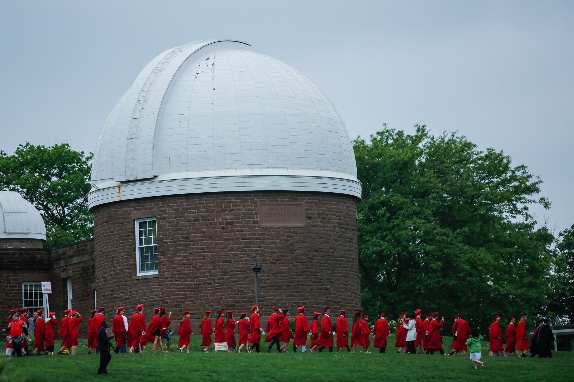 A spokesperson for Wesleyan University, where the cost of attendance exceeds $100,000 for the coming academic year, said the school 'commits to meeting students’ demonstrated financial need and, on average, students receive grants totaling $69,744.' Pictured here, students arrive to attend the commencement ceremony on May 27, 2018 at the Connecticut school