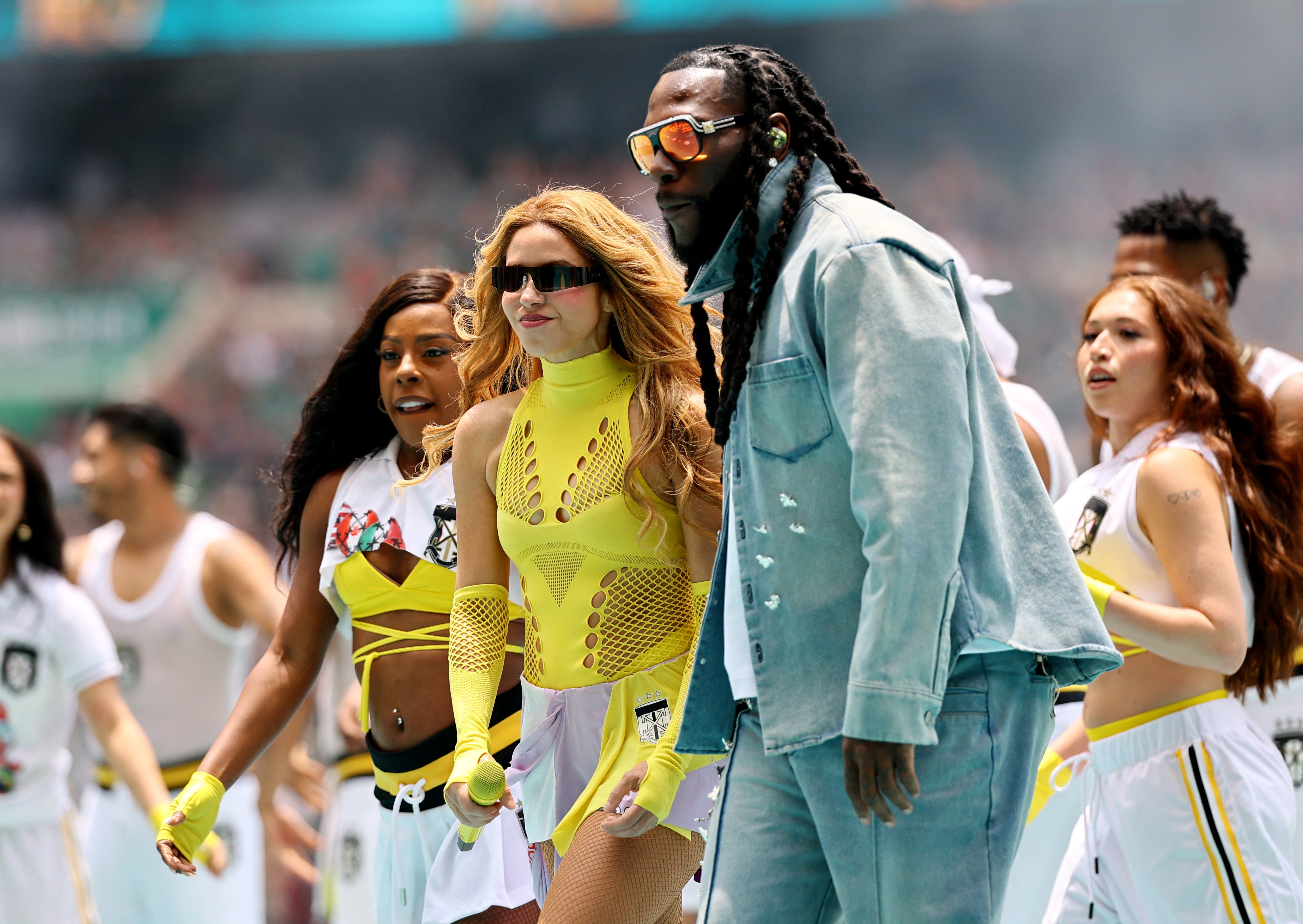 Shakira and Burna Boy perform during the opening ceremony