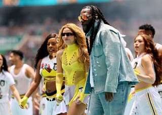 Shakira and Burna Boy perform during the opening ceremony