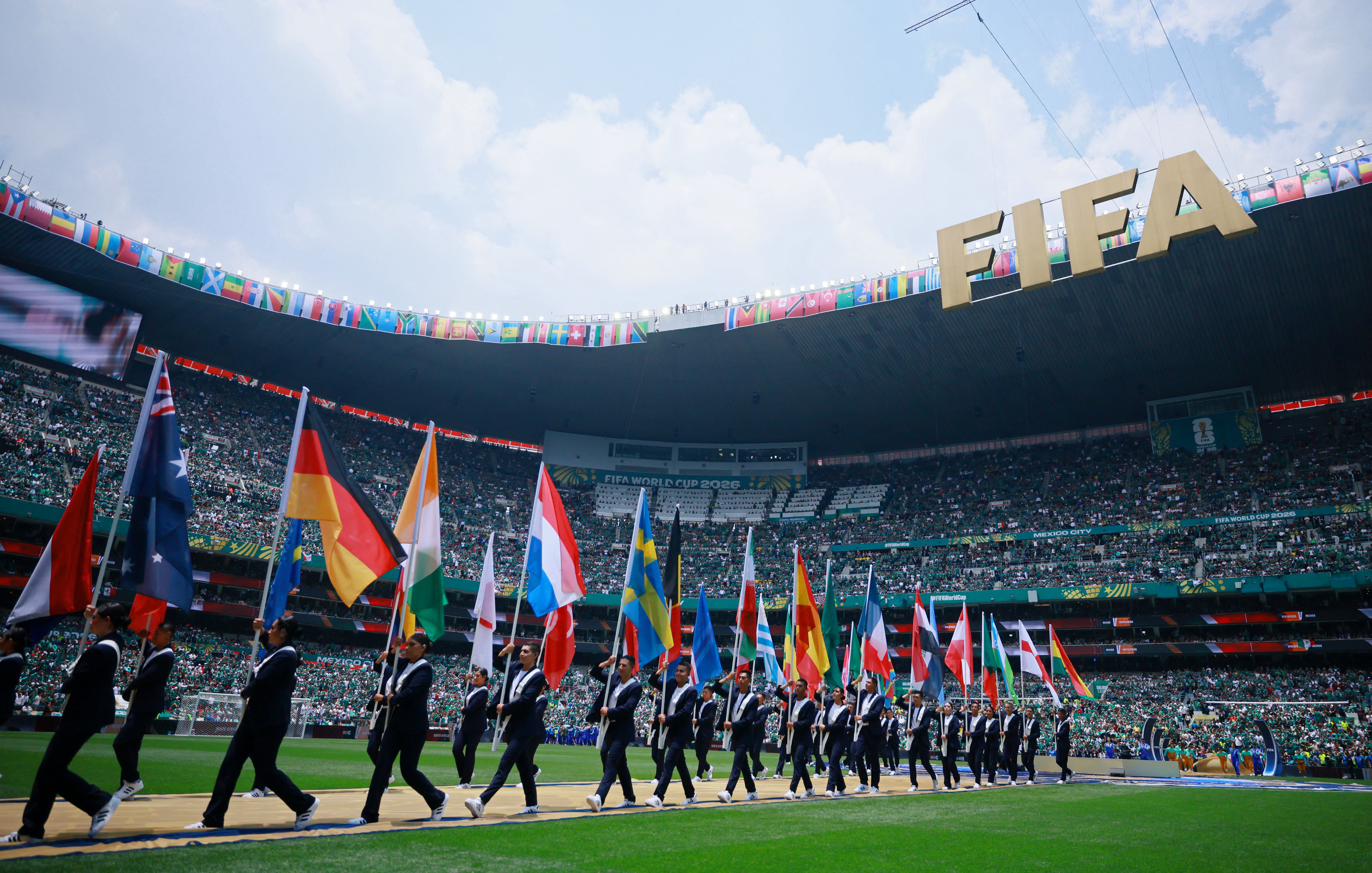 The flags of all 48 teams were paraded onto the pitch before kick-off