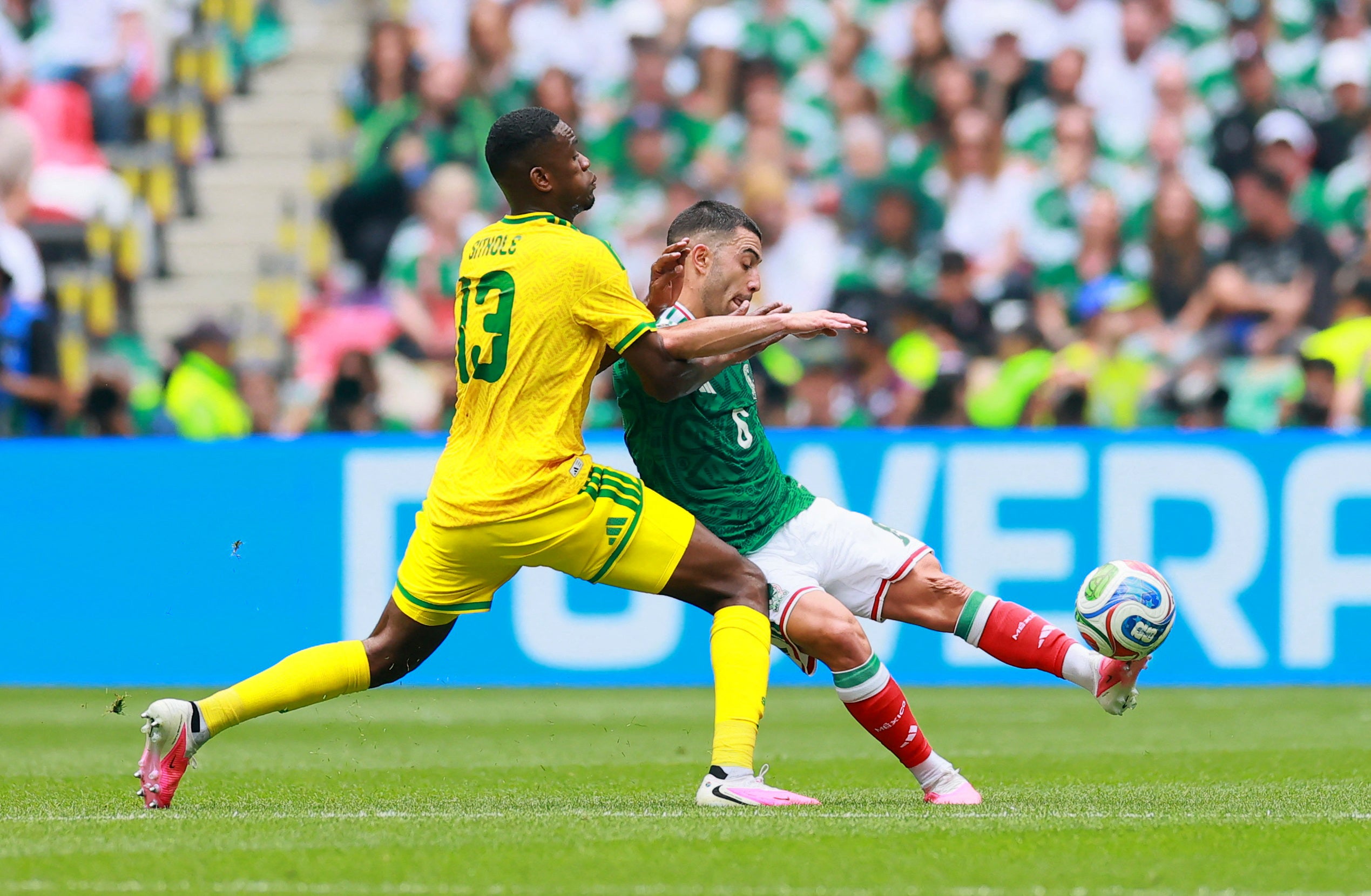 Mexico's Erik Lira in action with South Africa's Sphephelo Sithole (Reuters)