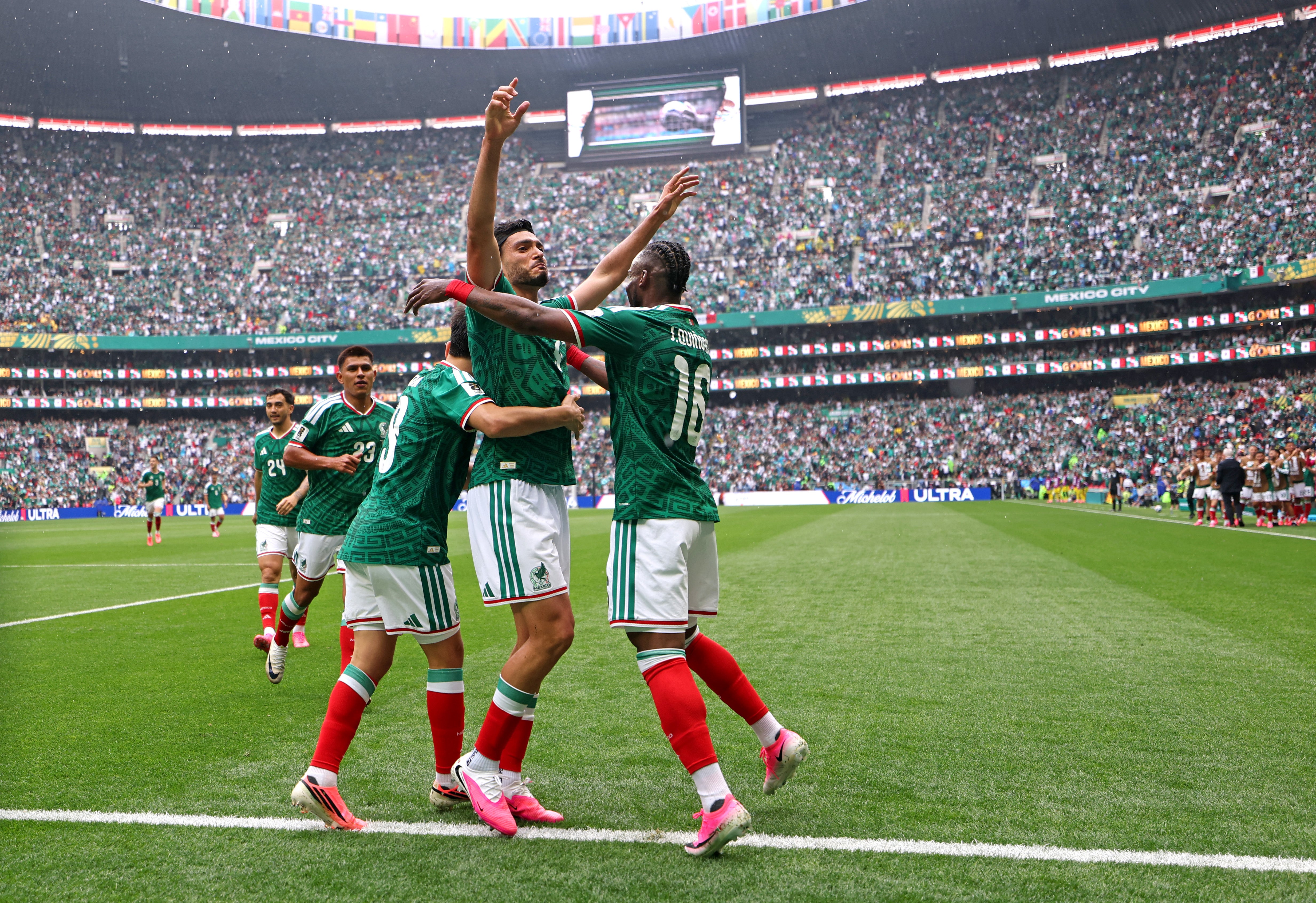Raul Jimenez of Mexico celebrates with teammates after scoring
