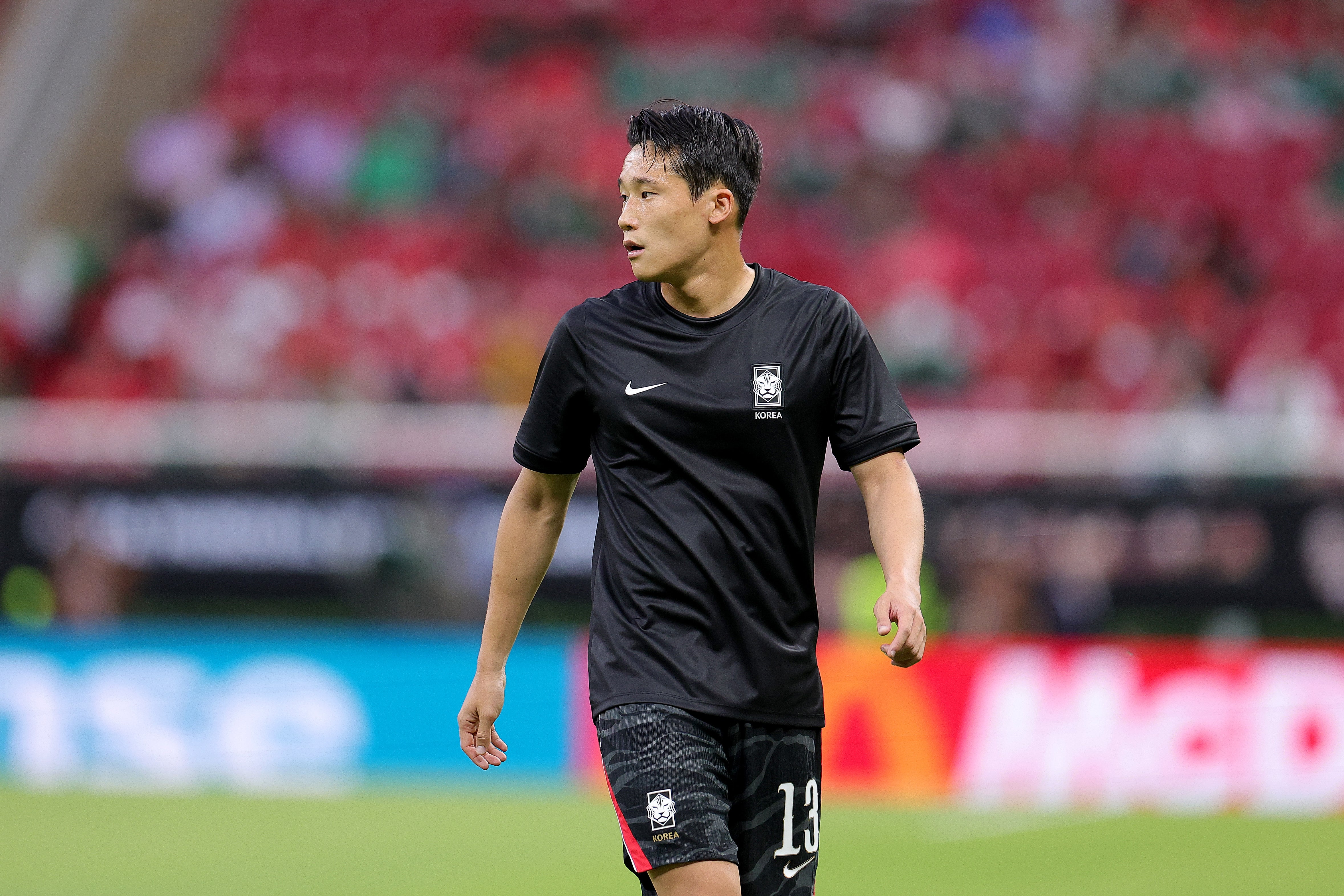 Tae-Seok Lee #13 of Korea Republic warms up