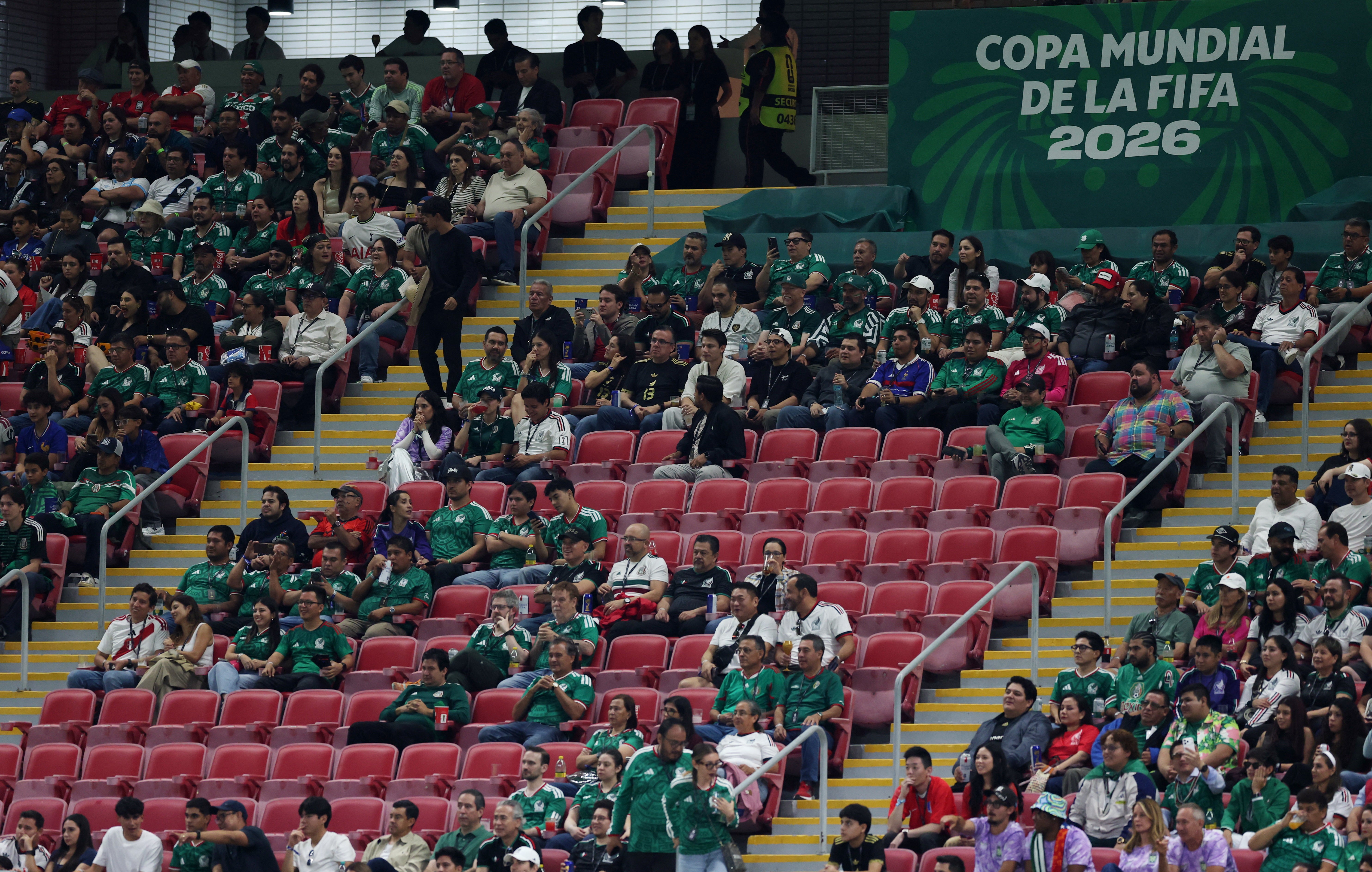 Empty seats are seen in the stands during the match (Reuters)