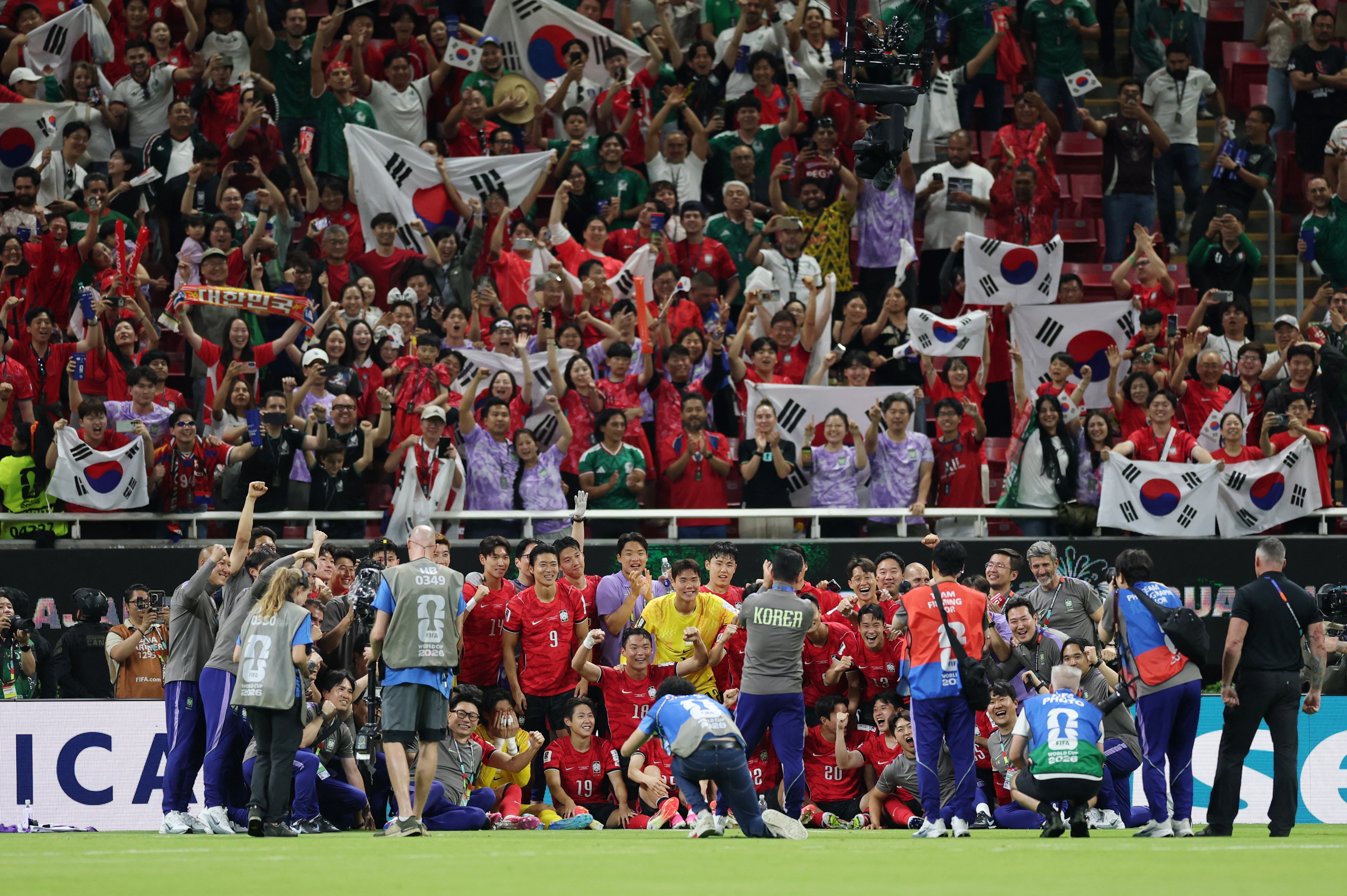 Korea pose for pictures at the end of the game (Reuters)