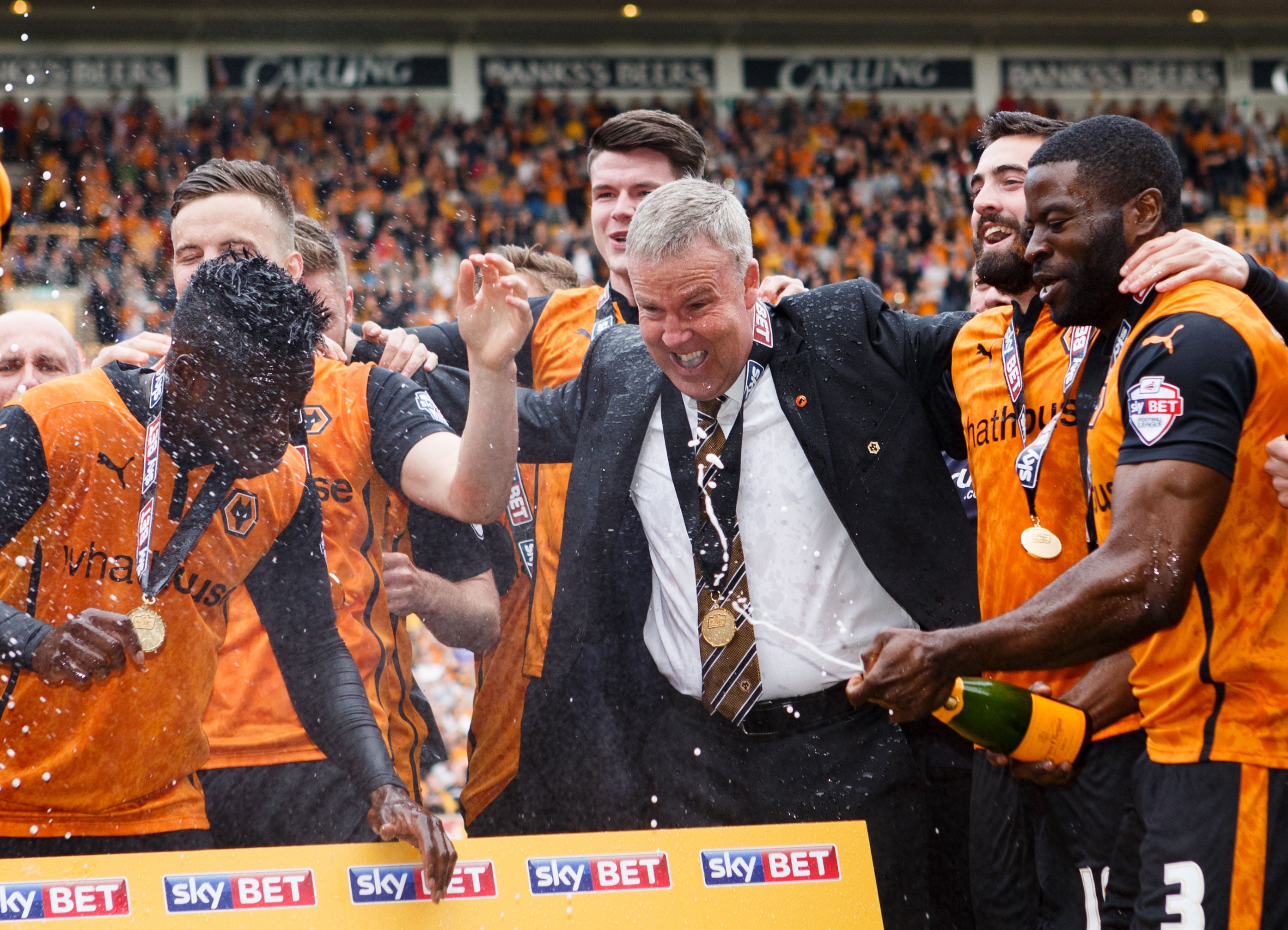 Wolverhampton Wanderers' manager Kenny Jackett celebrates their promotion as champions