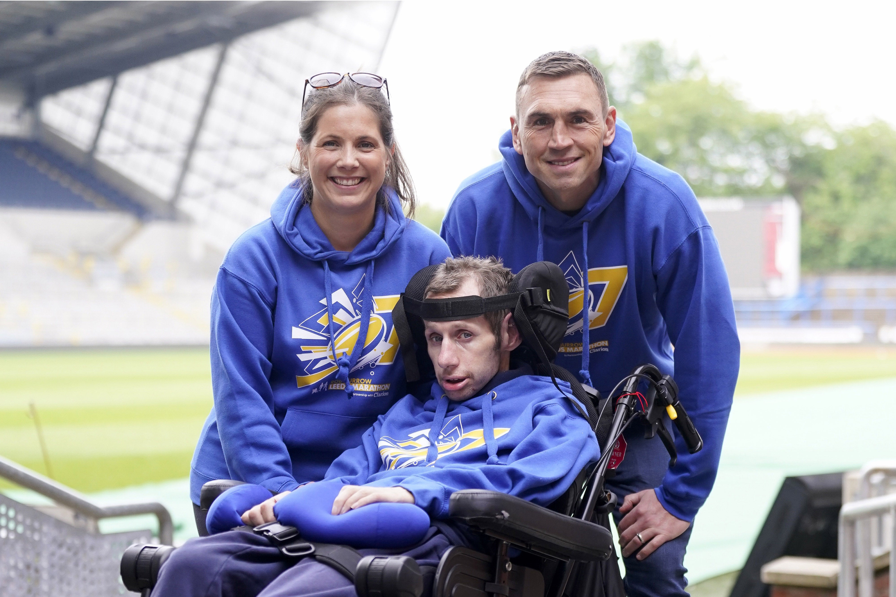 Rob Burrow (centre) with his wife Lindsey Burrow and Kevin Sinfield (right) (Danny Lawson/PA Wire)