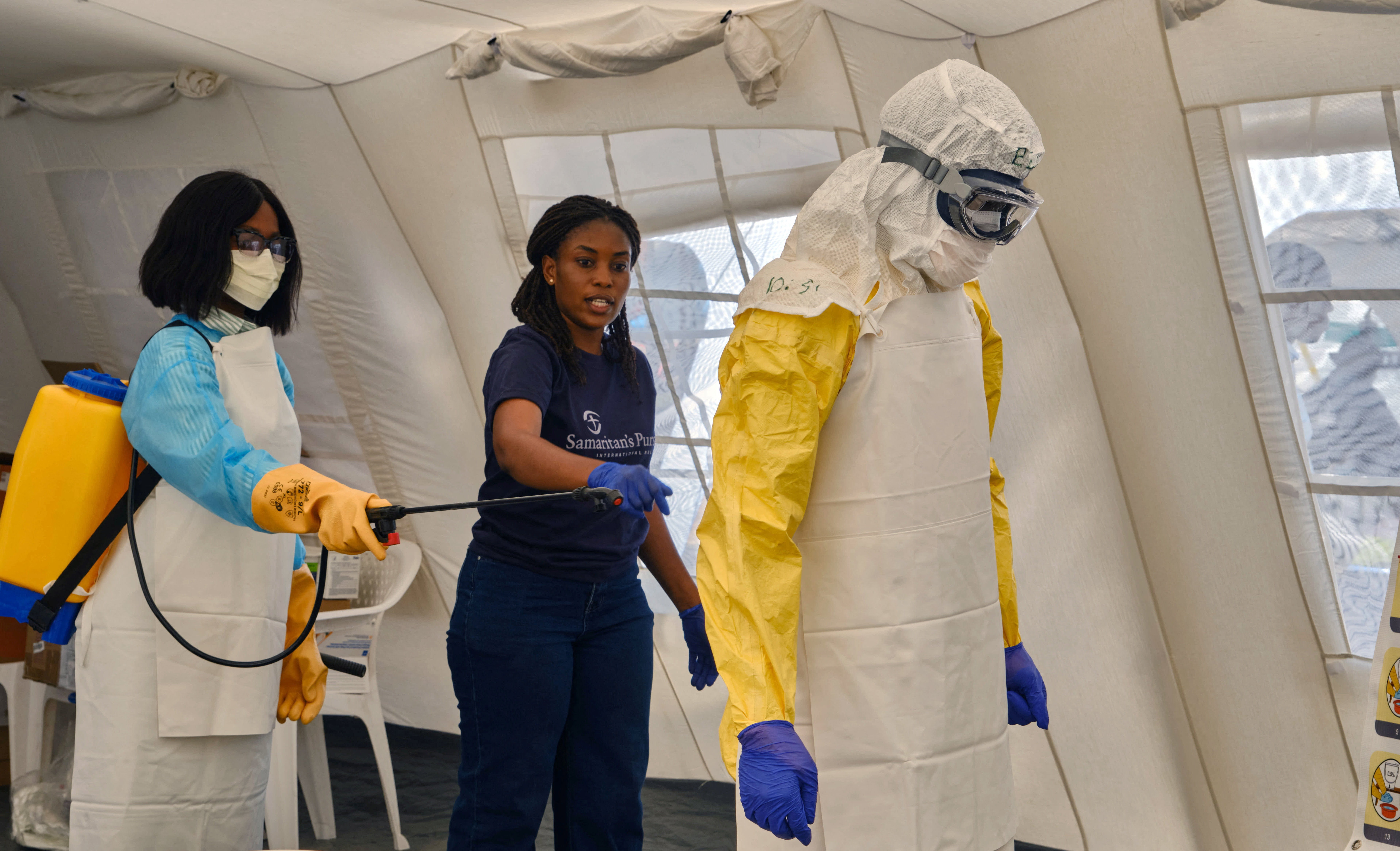 Congolese healthcare workers participate in an accelerated training session, at the newly built tents, in Bunia