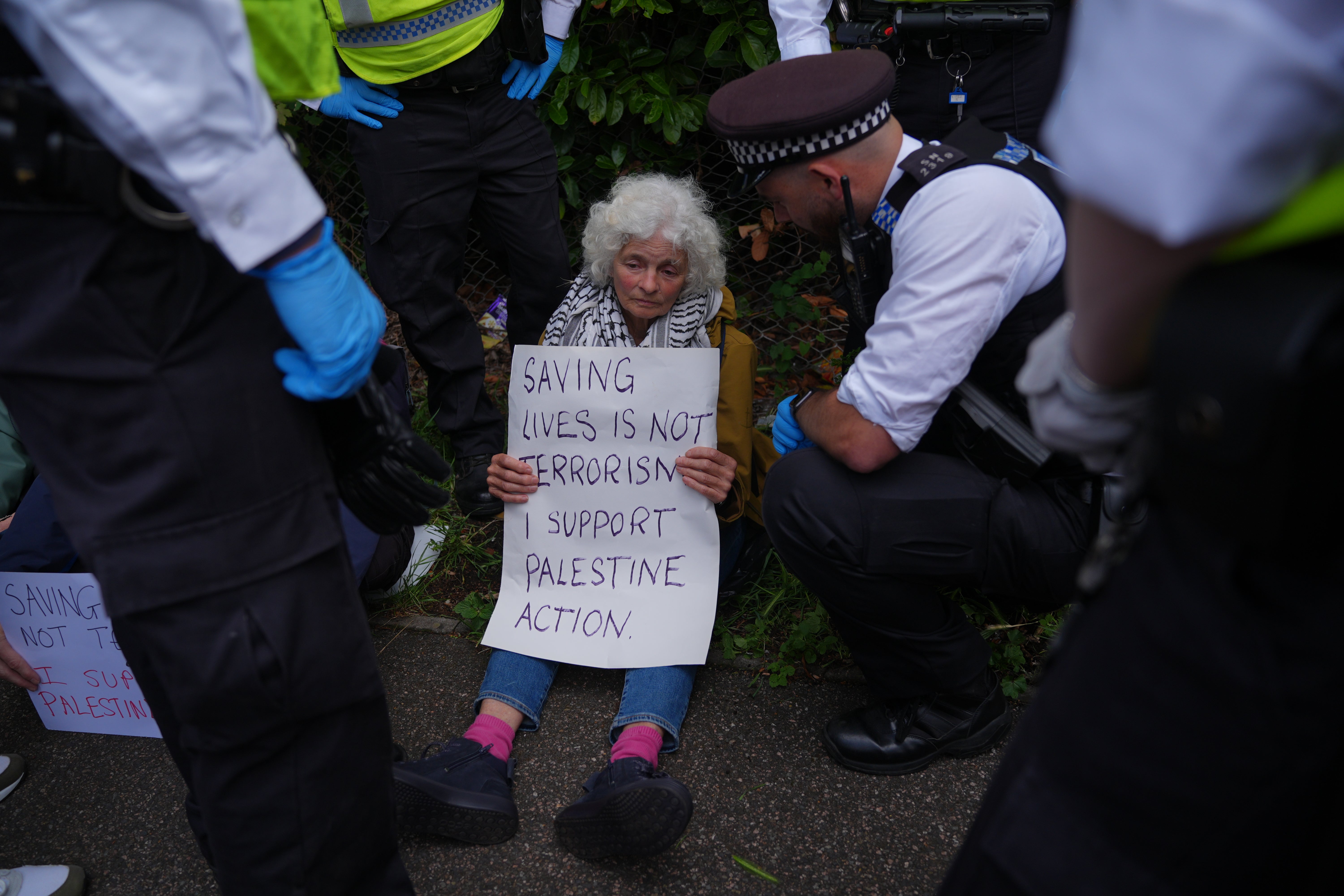 Many protesters held signs that said 'saving lives is not terrorism'