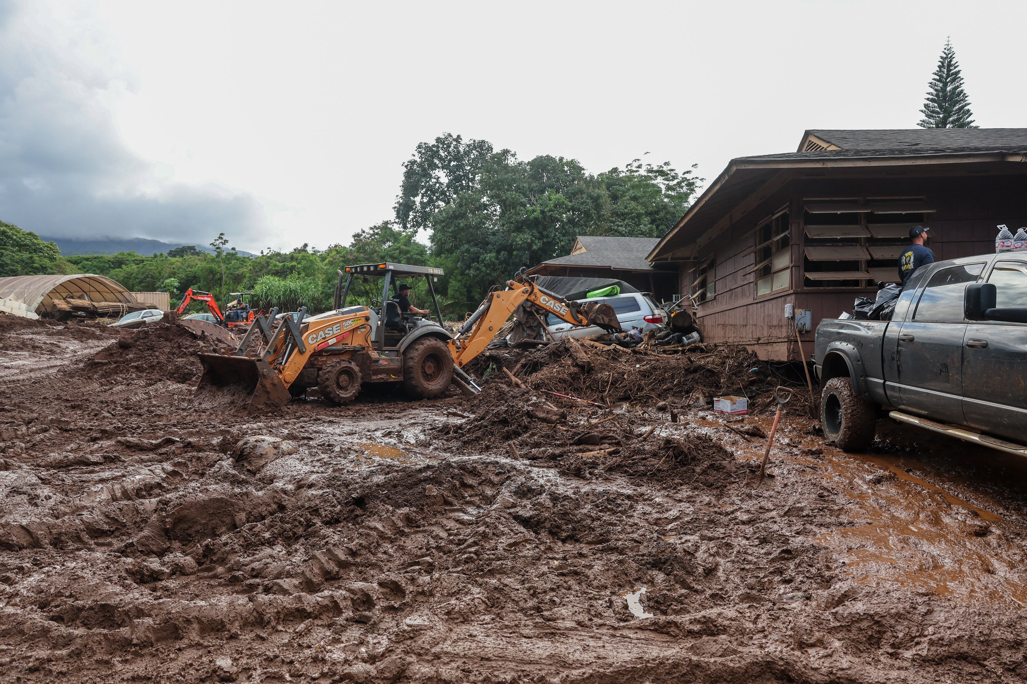 Volunteers in Waialua, Hawaii clean up after the Kona Low storm flood that hit the islands in March 2026. Hawaii’s Governor Josh Green declared a state of emergency in early March ahead of the storm (AFP/Getty)