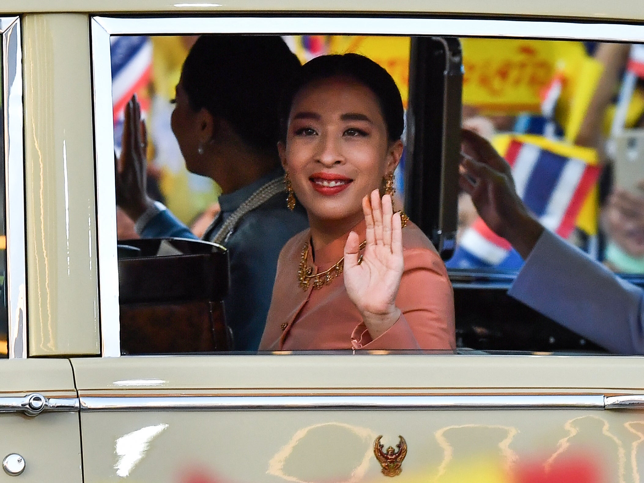 Thailand's Princess Bajrakitiyabha waves to supporters upon arrival at the Grand Palace in Bangkok on 1 November 2020 for a religious ceremony at a Buddhist temple inside the palace (AFP/Getty)