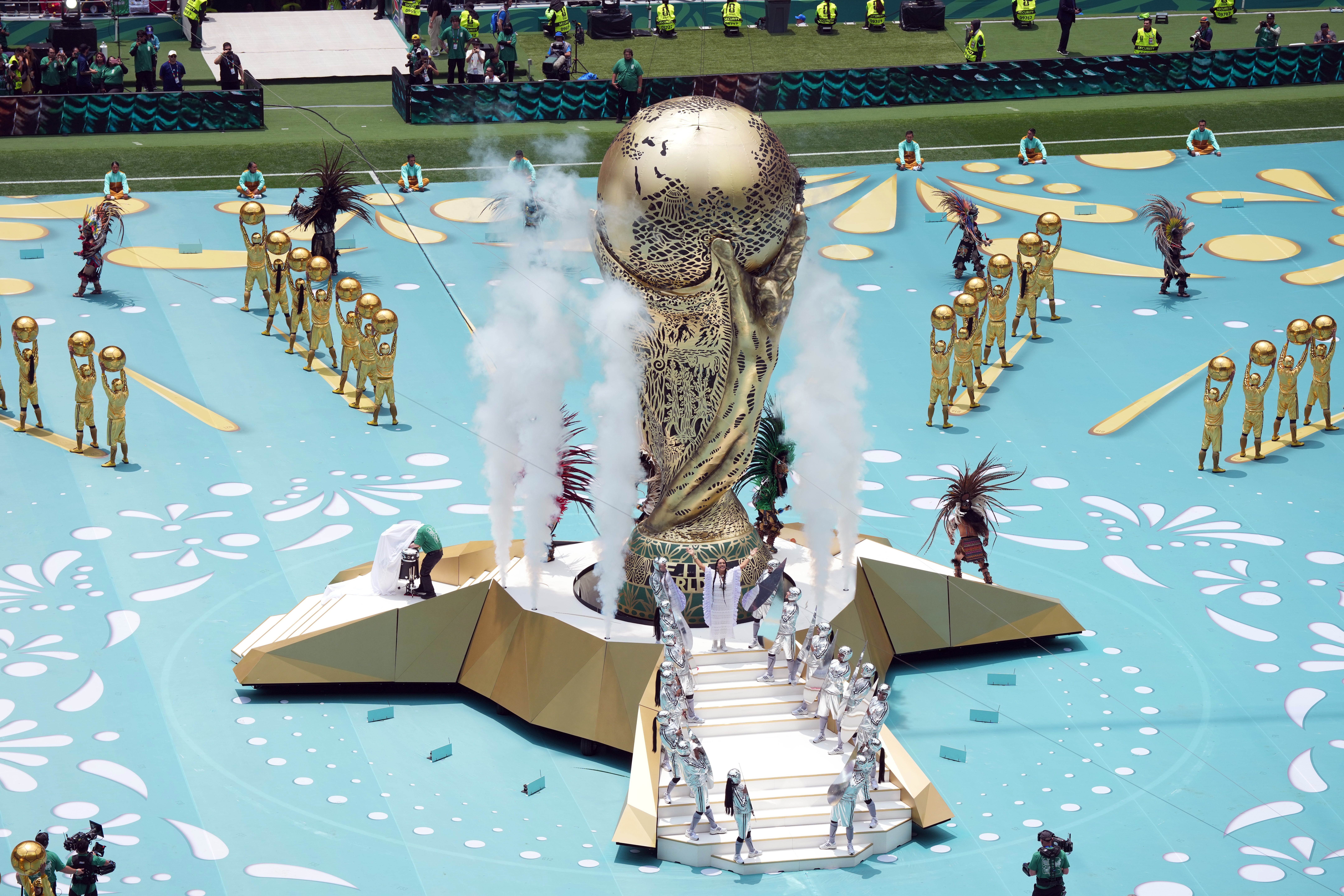 The World Cup opening ceremony in Mexico featured a giant gold trophy center stage
