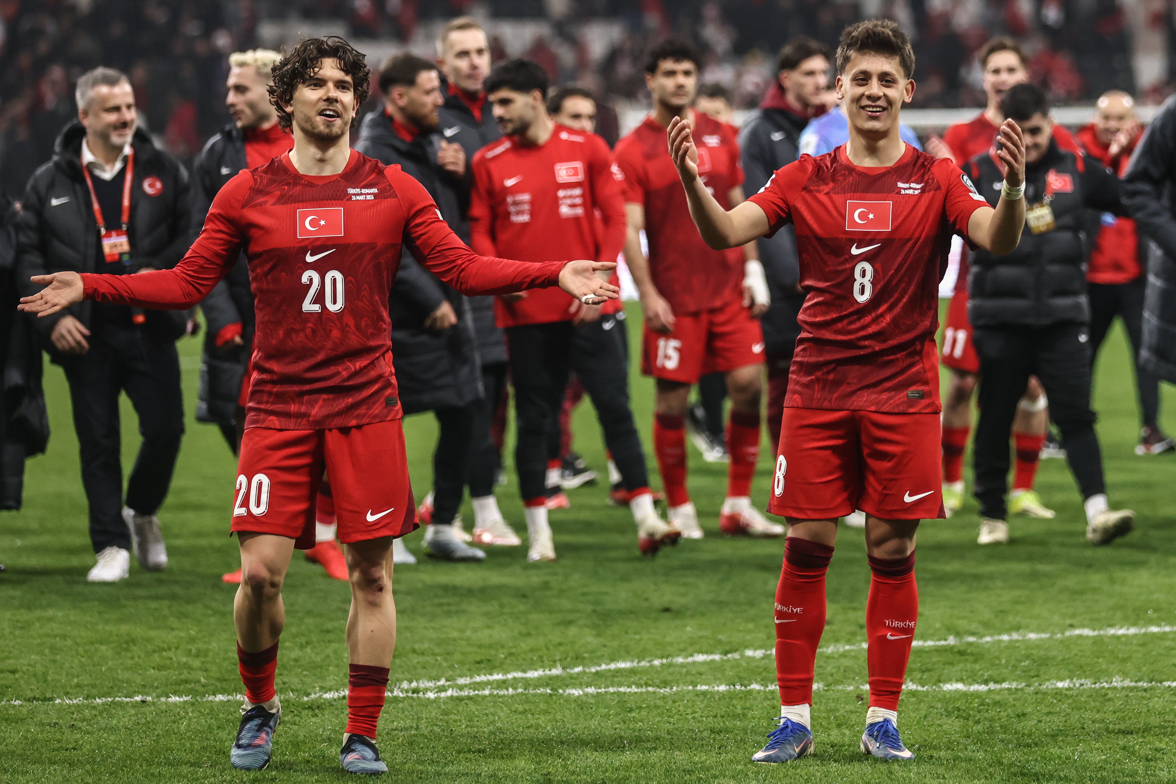 Kadiolgu and Guler celebrate during the World Cup play-offs