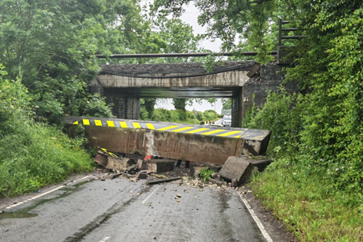 Railway bridge collapses after lorry crash causing West Coast Main Line mayhem Railway bridge collapses after lorry crash causing West Coast Main Line mayhem
