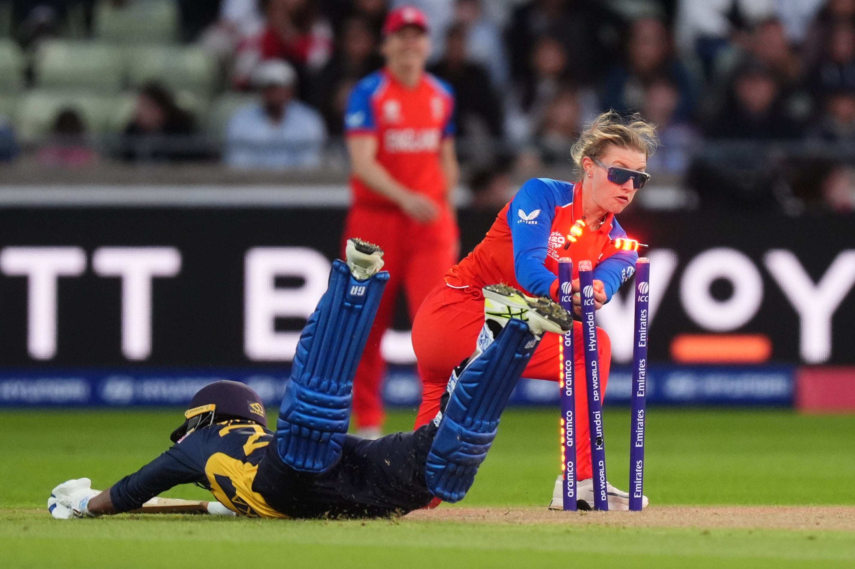 England's Charlie Dean attempts a run-out on Sri Lanka's Kavisha Dilhari
