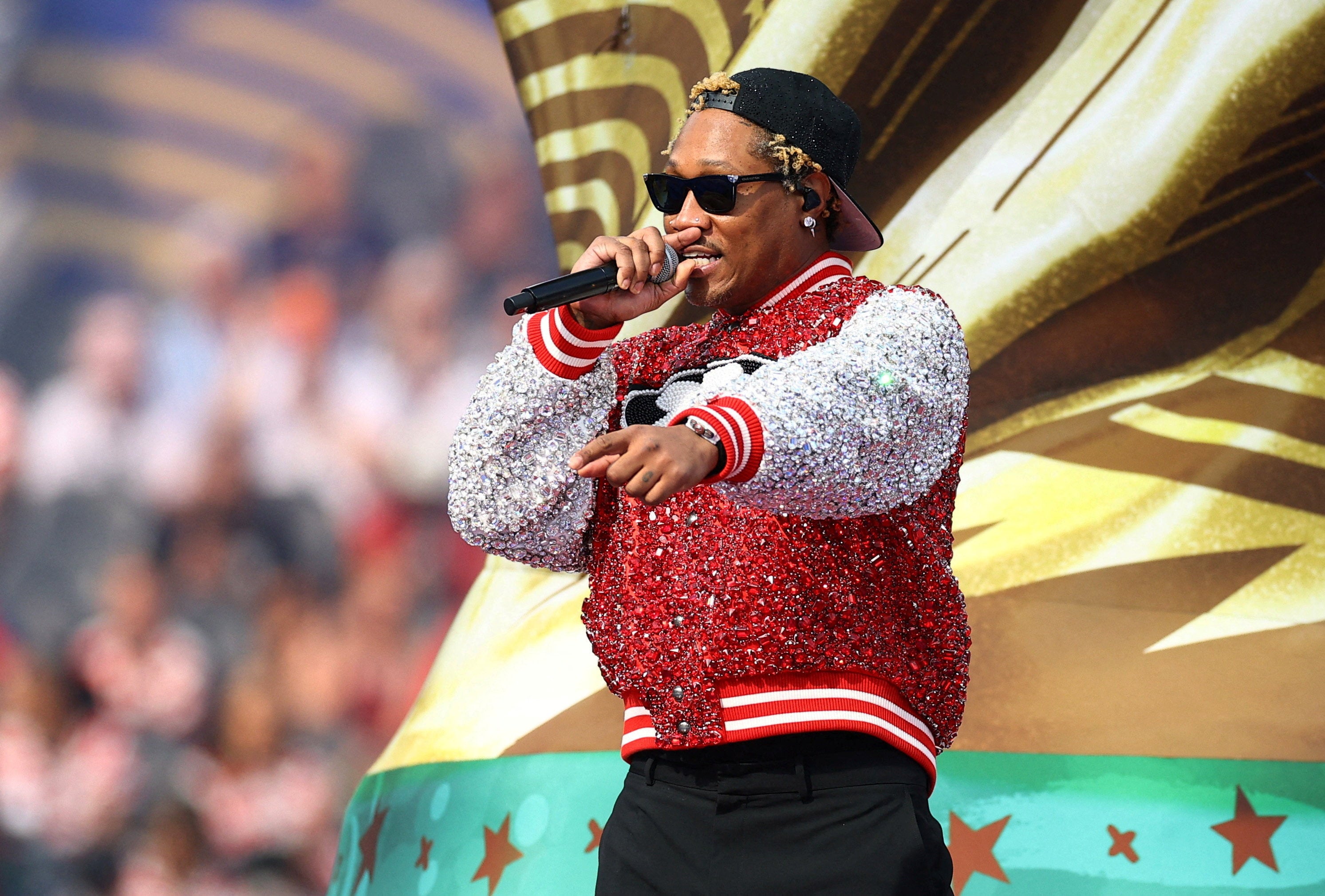 Future performed in front of a giant World Cup trophy
