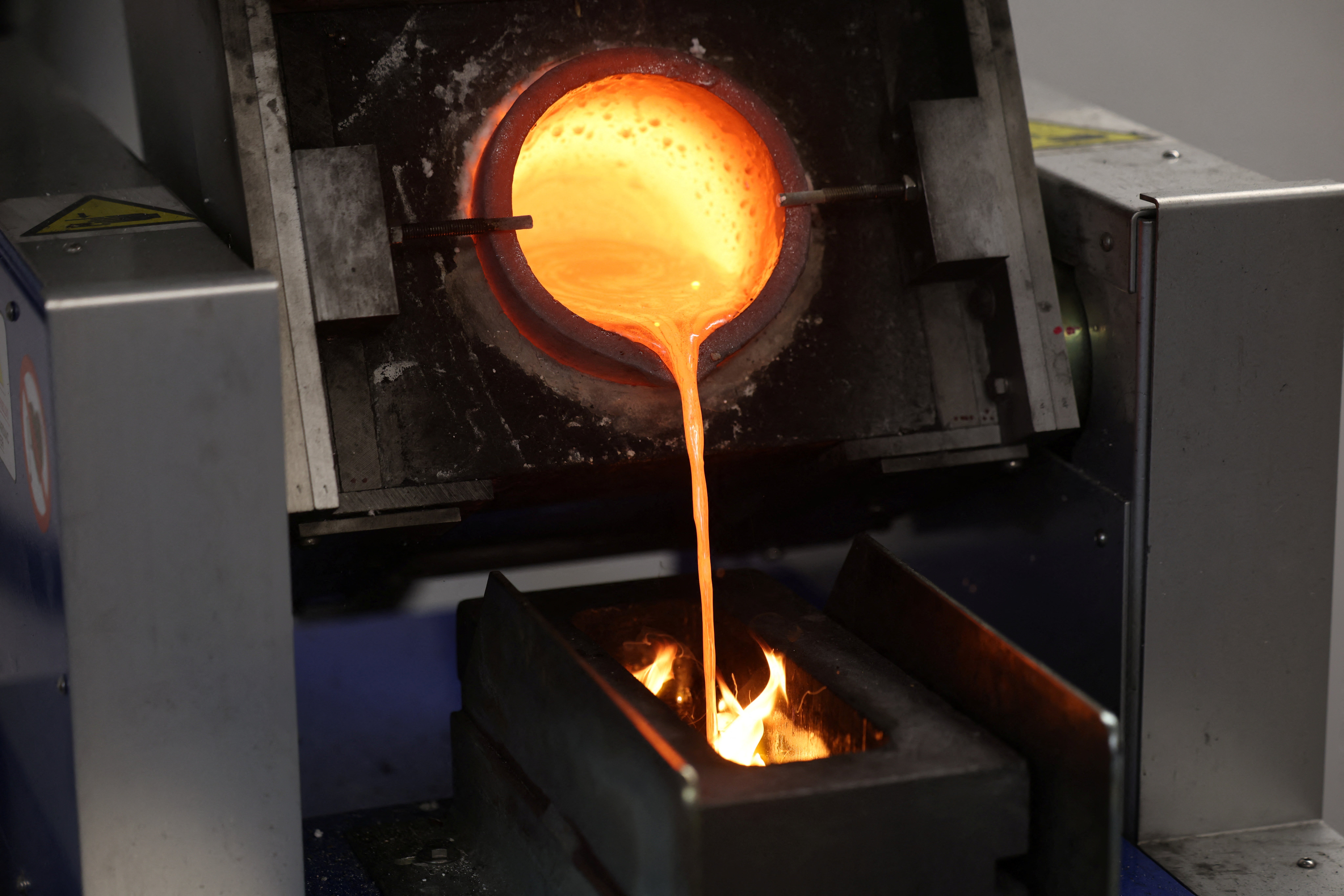 Molten gold from old jewellery, including luxury watches, is poured into a mould at Hatton Garden Metals in London, Britain, June 10, 2026
