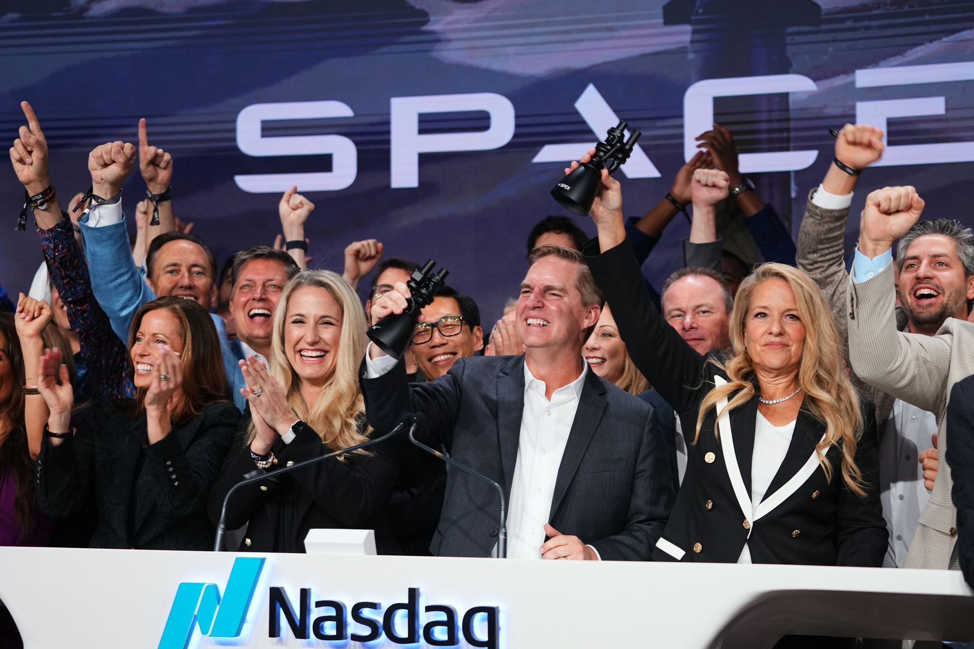 Gwynne Shotwell, President and COO of SpaceX, right, celebrates with colleagues during a bell ringing ceremony for the IPO of SpaceX at the Nasdaq MarketSite in New York, Friday, June 12, 2026 (AP Photo/Frank Franklin II)