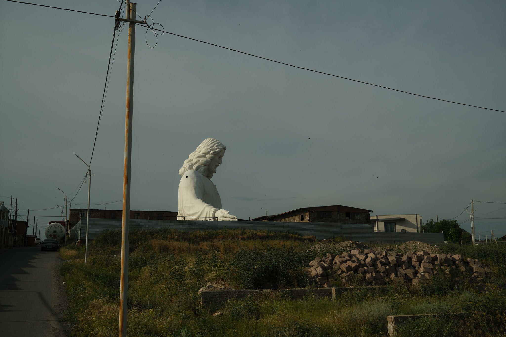 The top half of the Jesus statue can be seen on approach